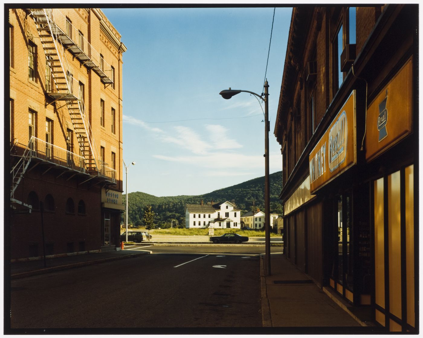 View of Holden Street with two buildings and a street light, North Adams, Massachusetts