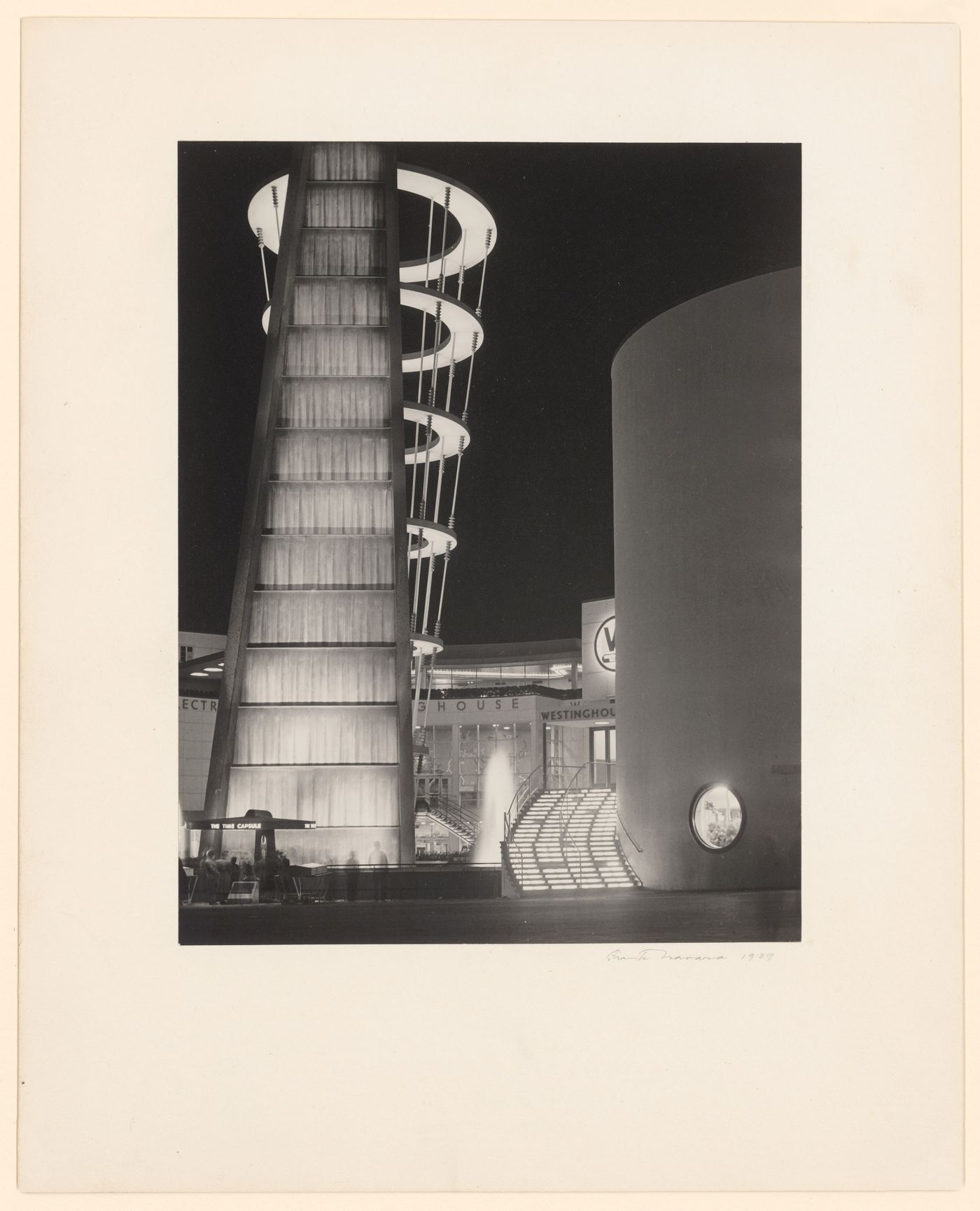 New York World's Fair (1939-1940): Night view of Time Capsule and the Singing Tower of Light in front of the Westinghouse Electric and Manufacturing Company Building