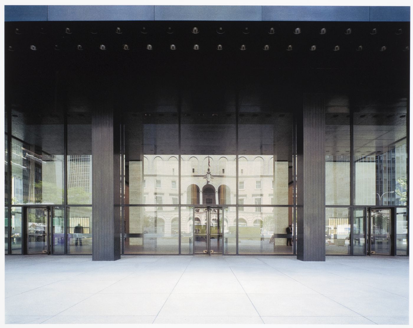 Seagram Building, New York City: view from under the canopy, with the Racquet and Tennis Club reflected in the lobby enclosure