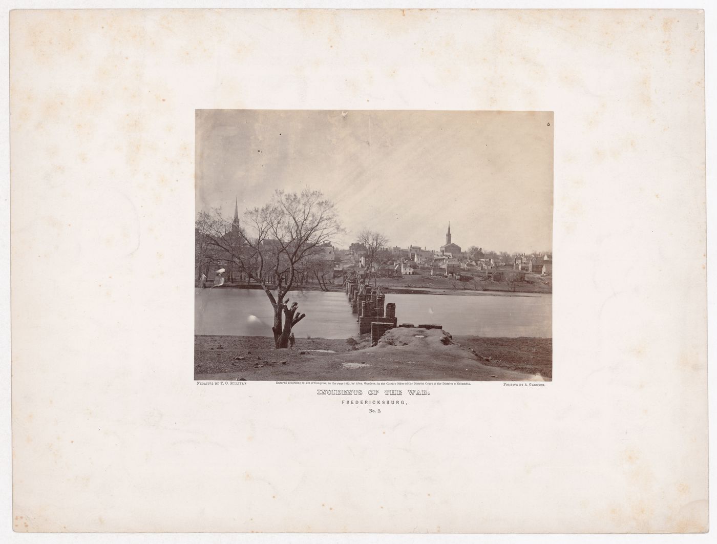 View of the ruins of a bridge with the town of Fredericksburg in the background, Virginia, United States