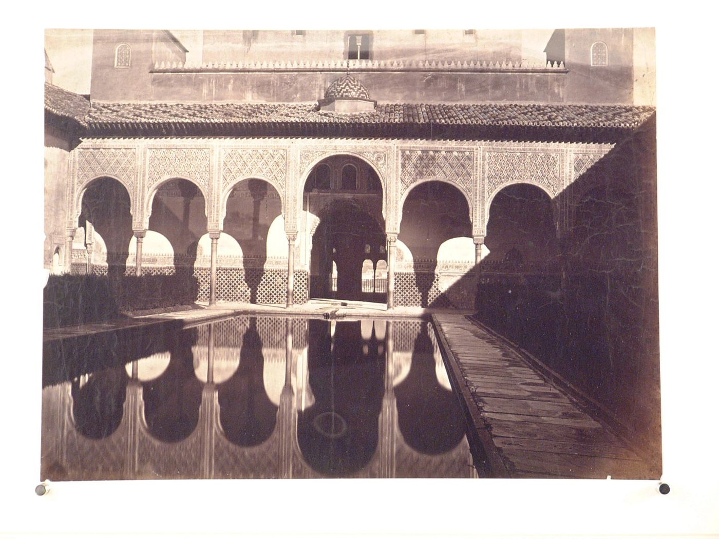 Alhambra, Patio de Los Arrayanes, view showing one end of poolmeeting the interior portico, Granada, Spain