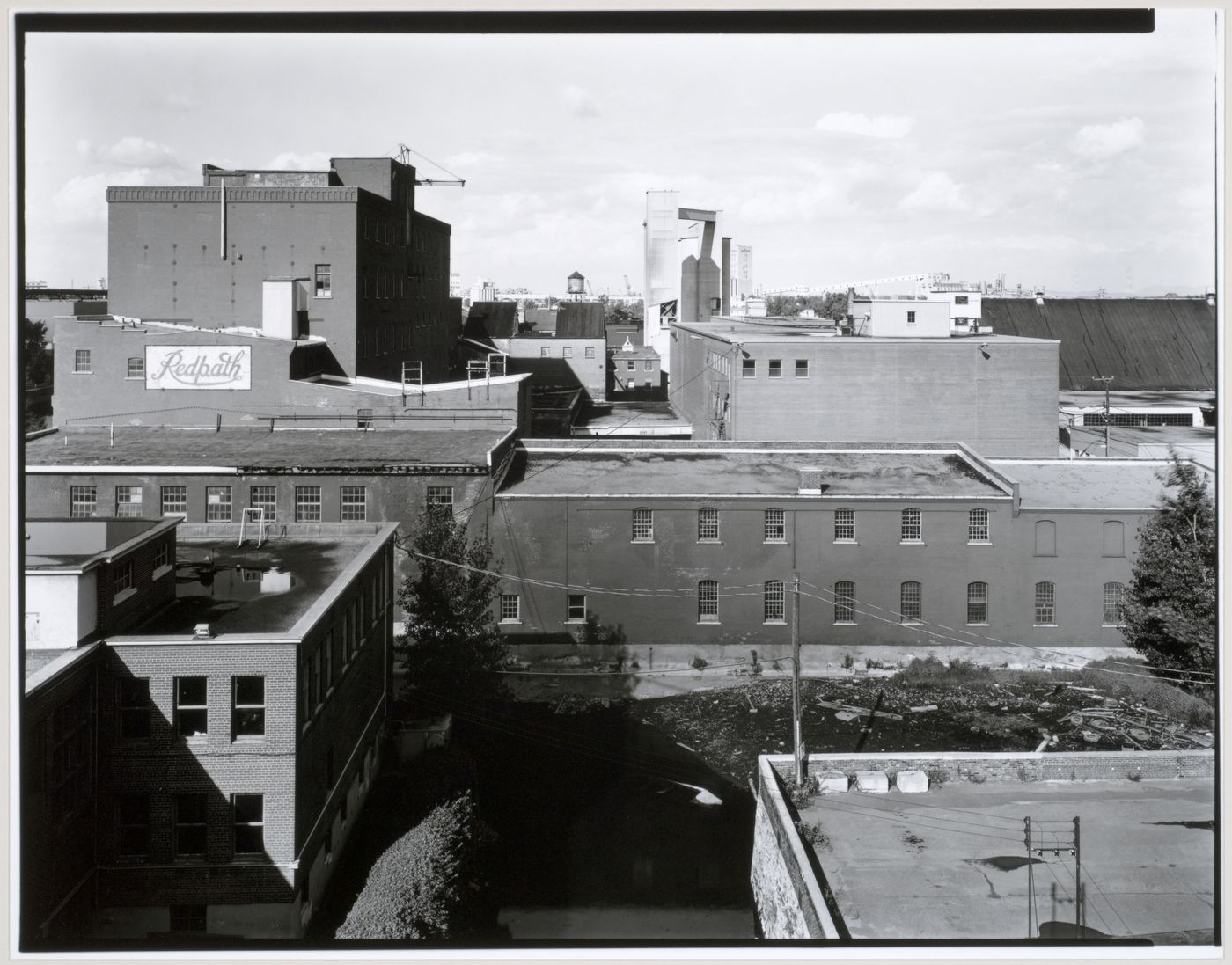 View of the Redpath Sugar Refinery looking east from the roof of the Belding Corticelli Spinning Mill, Montréal, Québec