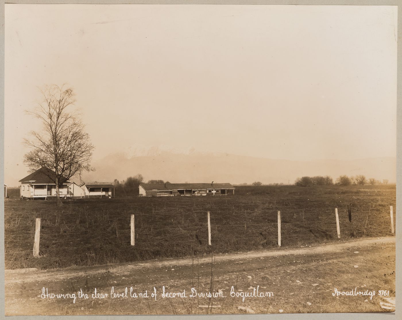 View of a farmhouse [?] on land designated for the development of the Second Division, the industrial center of Coquitlam (now Port Coquitlam), British Columbia