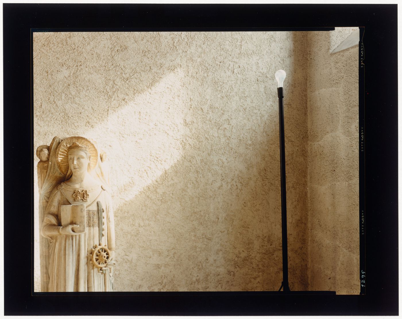 Interior view of a gallery showing a statue and a lamp, Museo di Castelvecchio, Verona, Italy