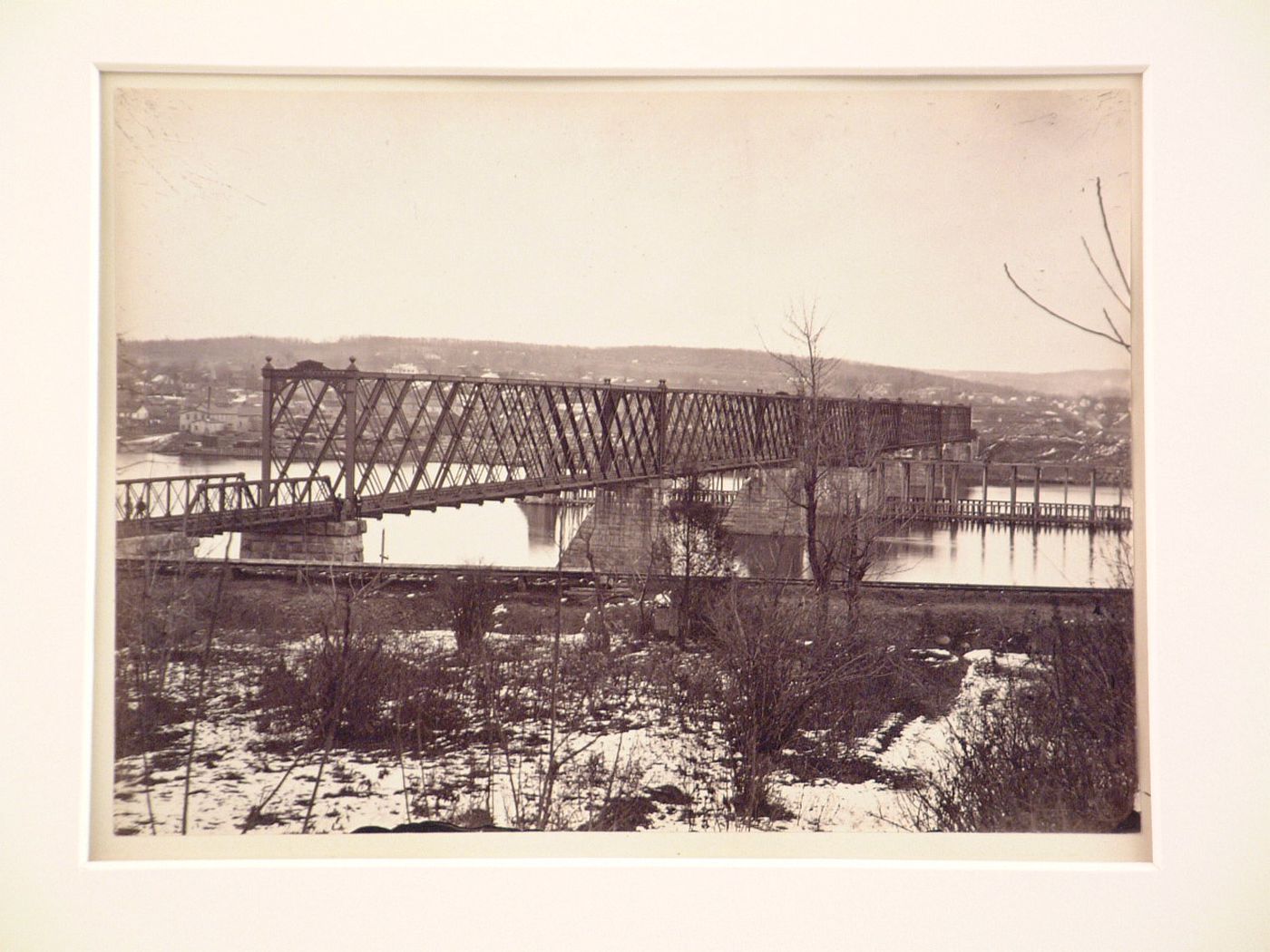 Metal bridge over a river, figures on bridge, Middletown, Connecticut