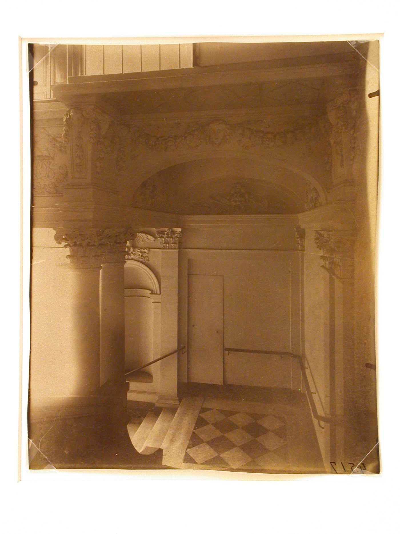 Hôtel de Beauvais: Interior view showing staircase landing and sculptural details on archway above, Paris, France