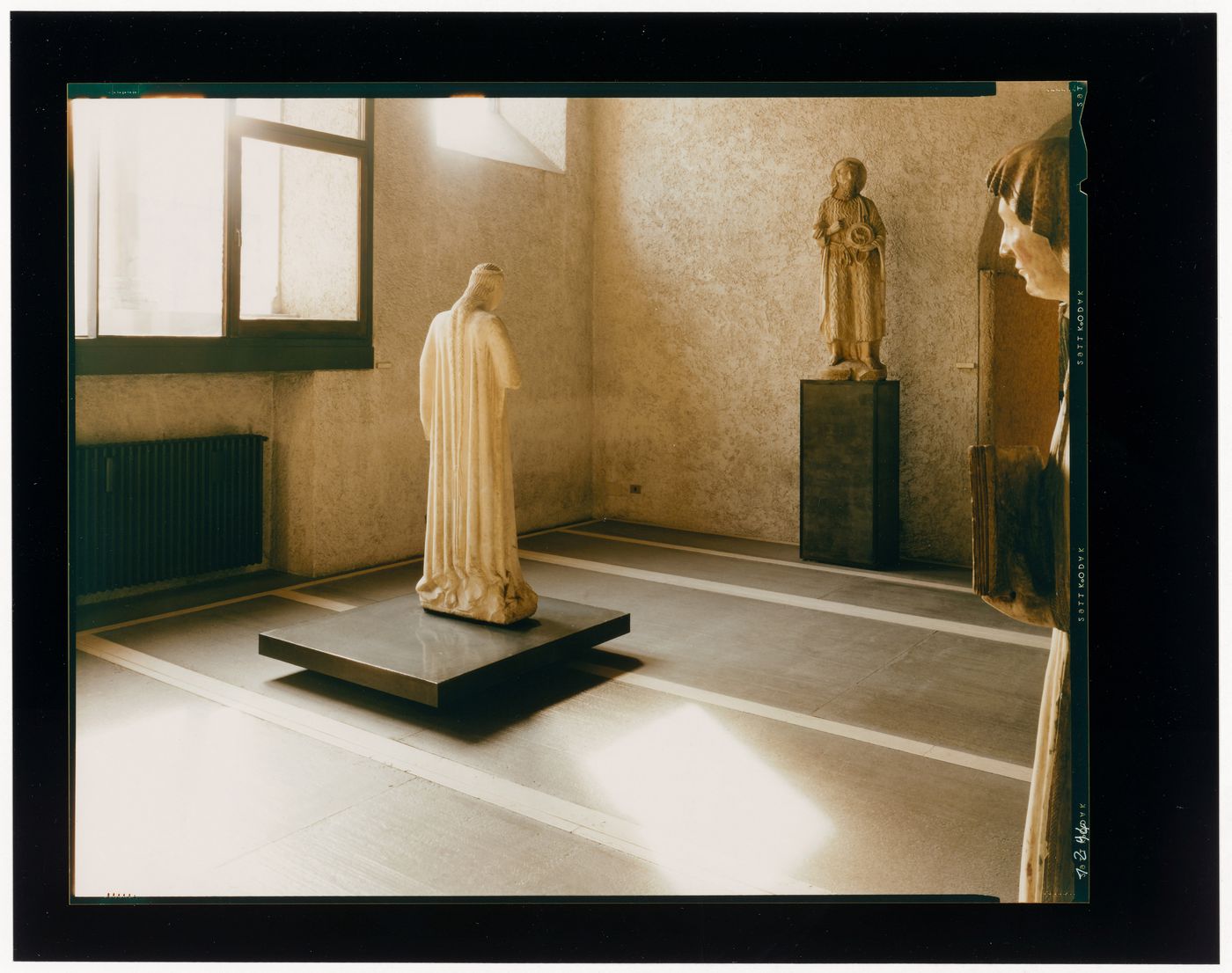 Interior view of a gallery showing statues and windows, Museo di Castelvecchio, Verona, Italy