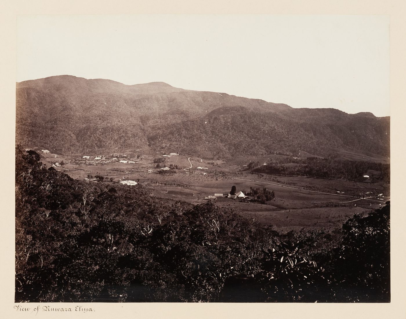 Distant view of Nuwara Eliya with mountains in the background, Ceylon (now Sri Lanka)