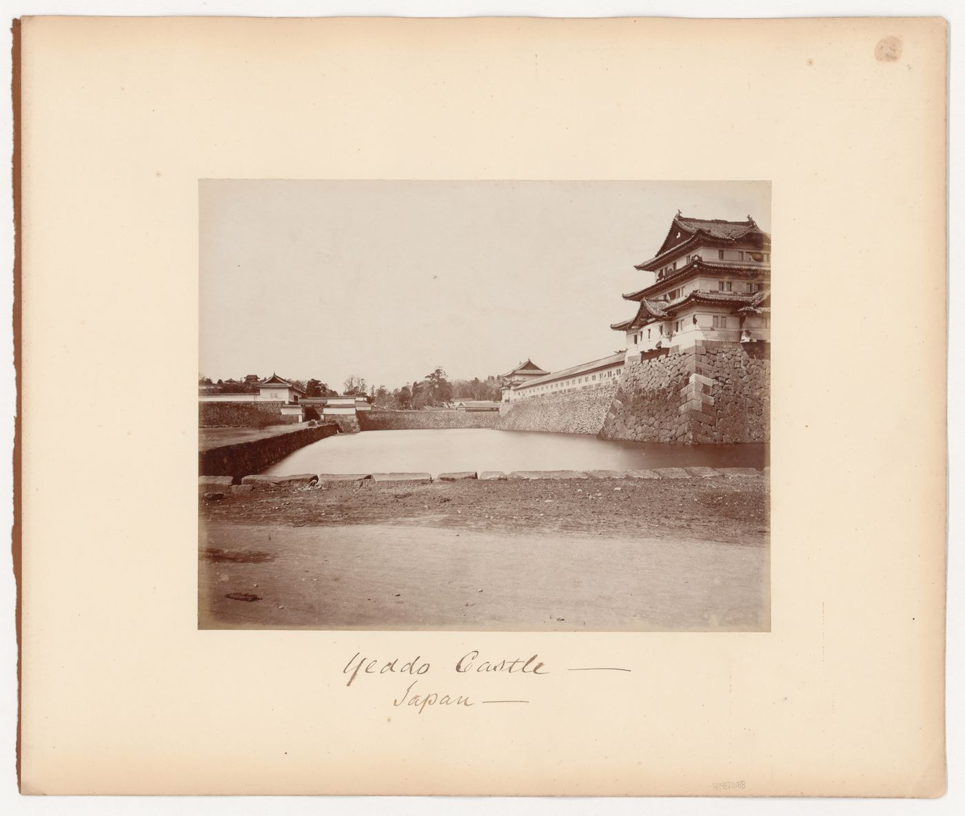 Partial view of Edojo [Edo Castle] showing watchtowers, a moat and defensive walls, Edo (now Tokyo), Japan