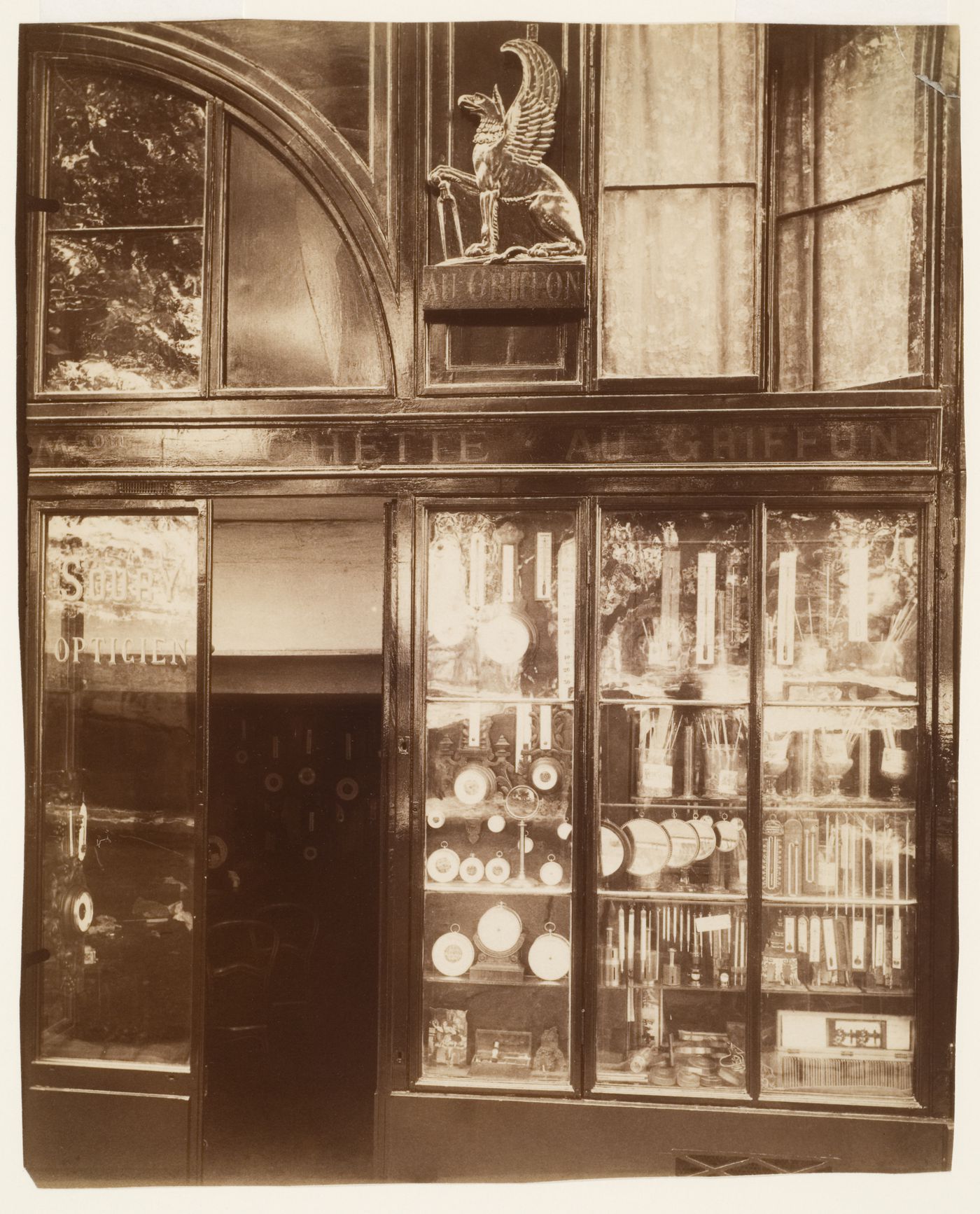 Detail of shop window with many clocks and thermometers, Paris, France