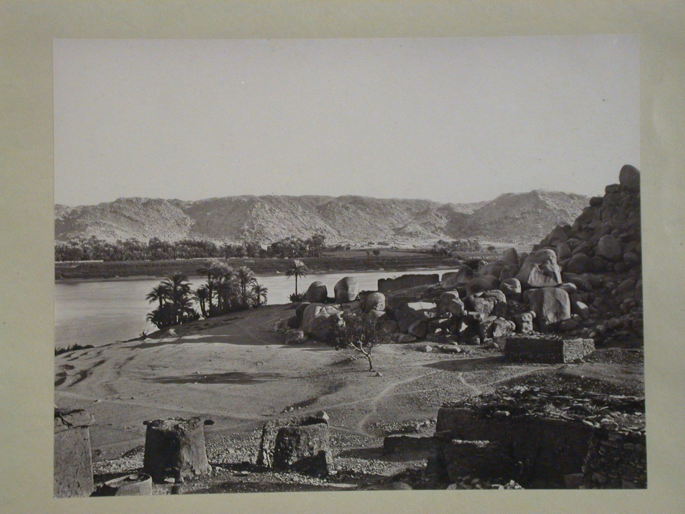 View of the Nile, looking East across river, with Nile sructures in foreground, Bigah Island [?], Egypt
