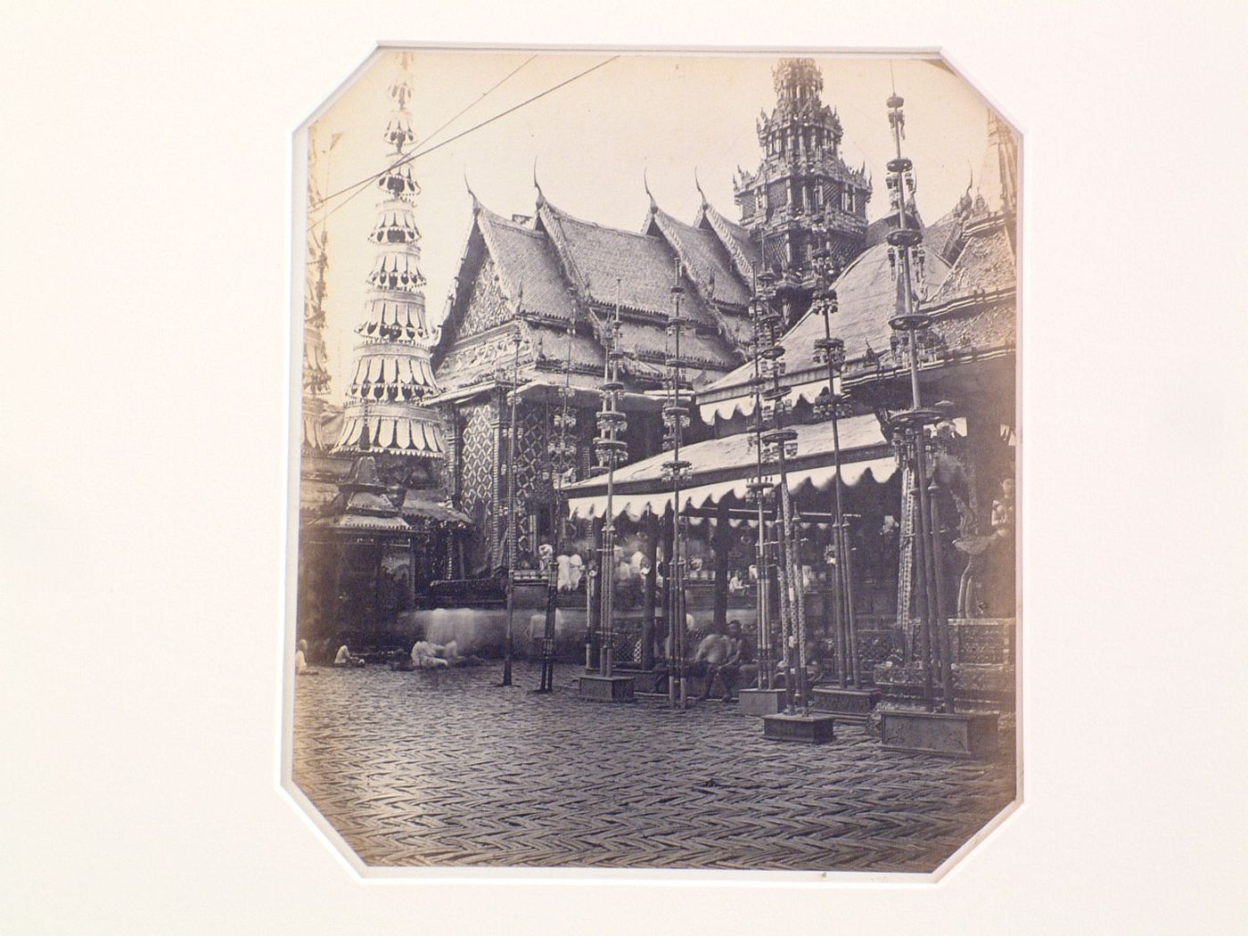 View of a temple showing a stupa and religious objects, probably in Bangkok, Siam (now Thailand)