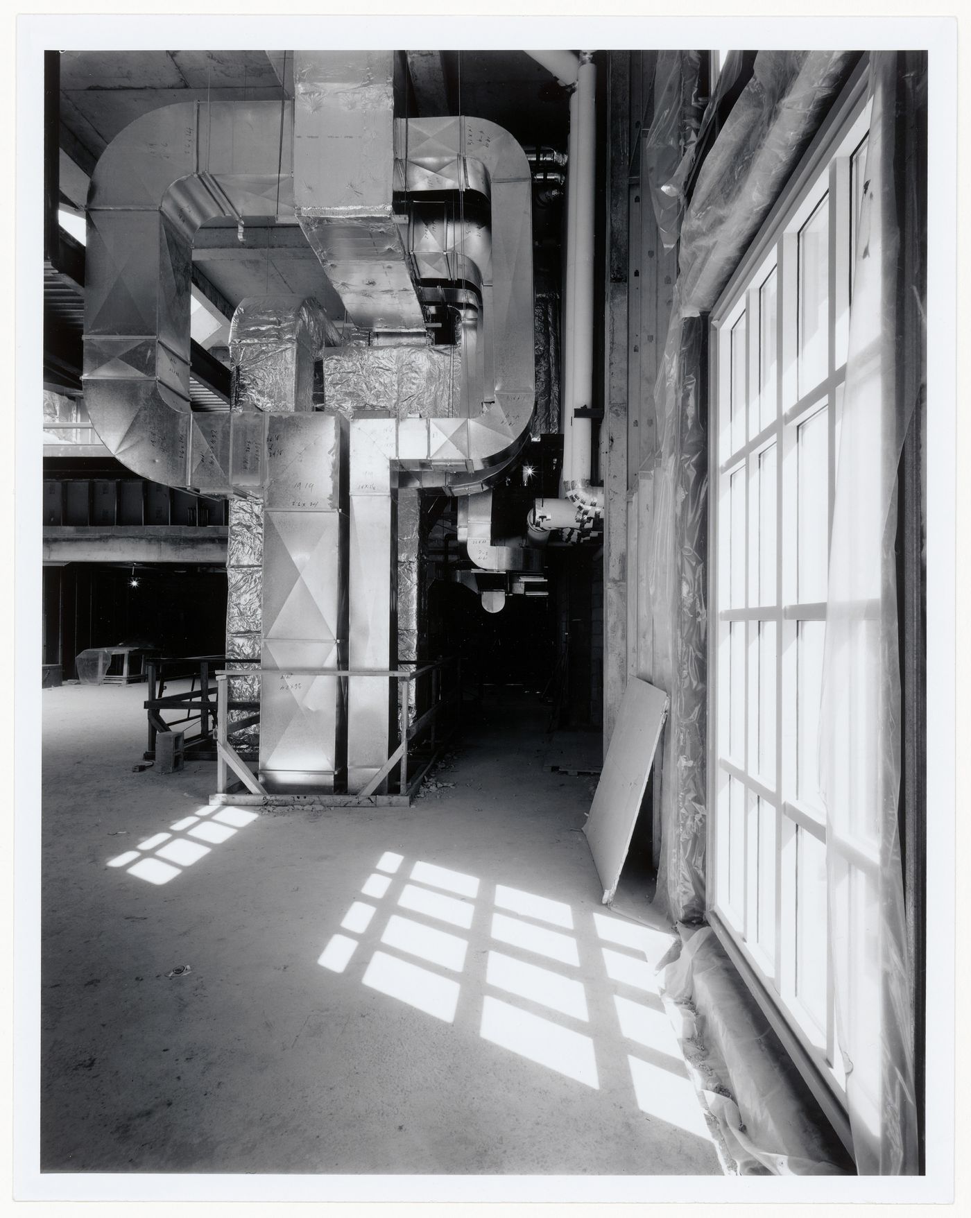 Interior view of the bookstore showing the air ducts adjacent to the Octagonal Gallery, Canadian Centre for Architecture under construction, Montréal, Québec