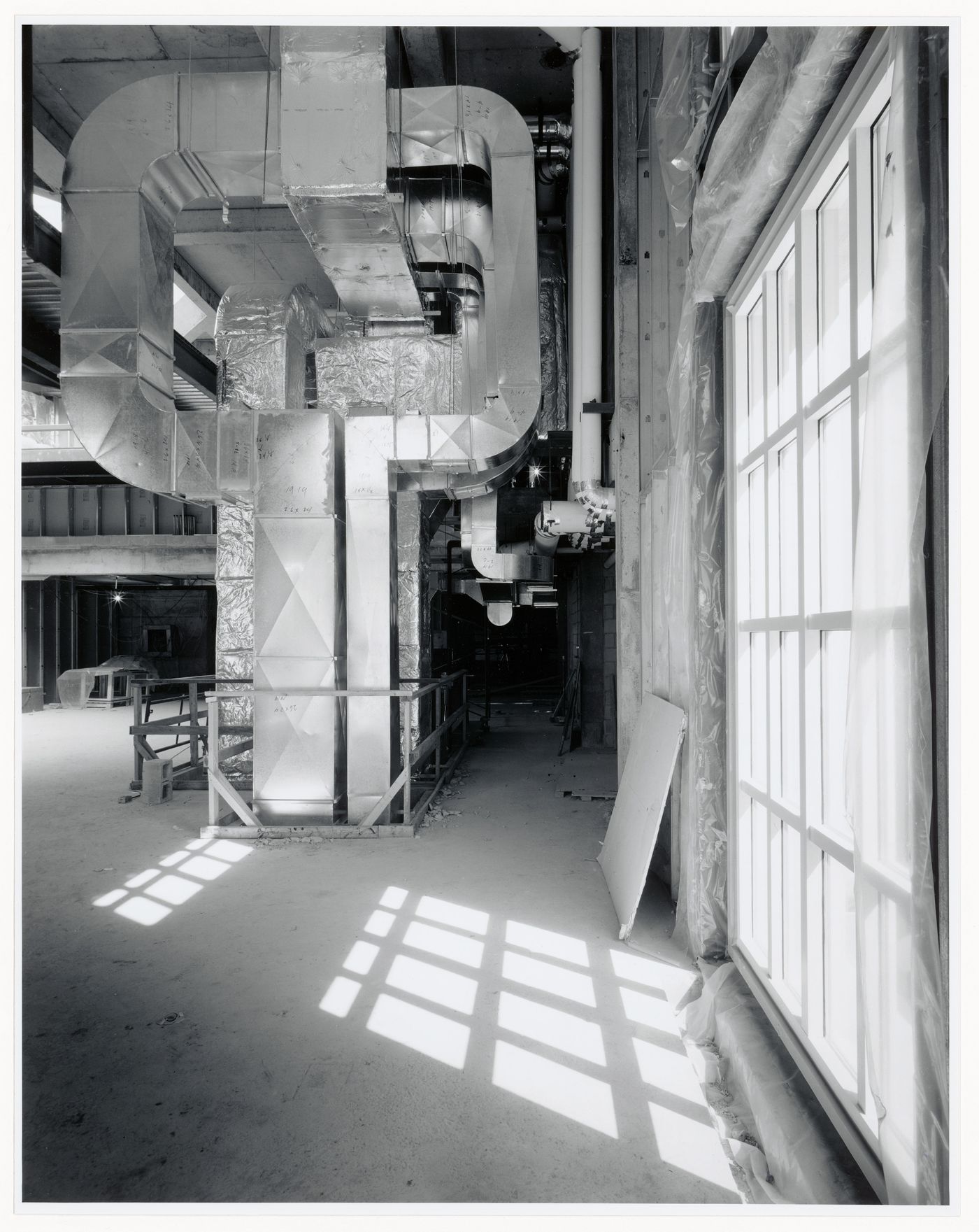 Interior view of the bookstore showing the air ducts adjacent to the Octagonal Gallery, Canadian Centre for Architecture under construction, Montréal, Québec