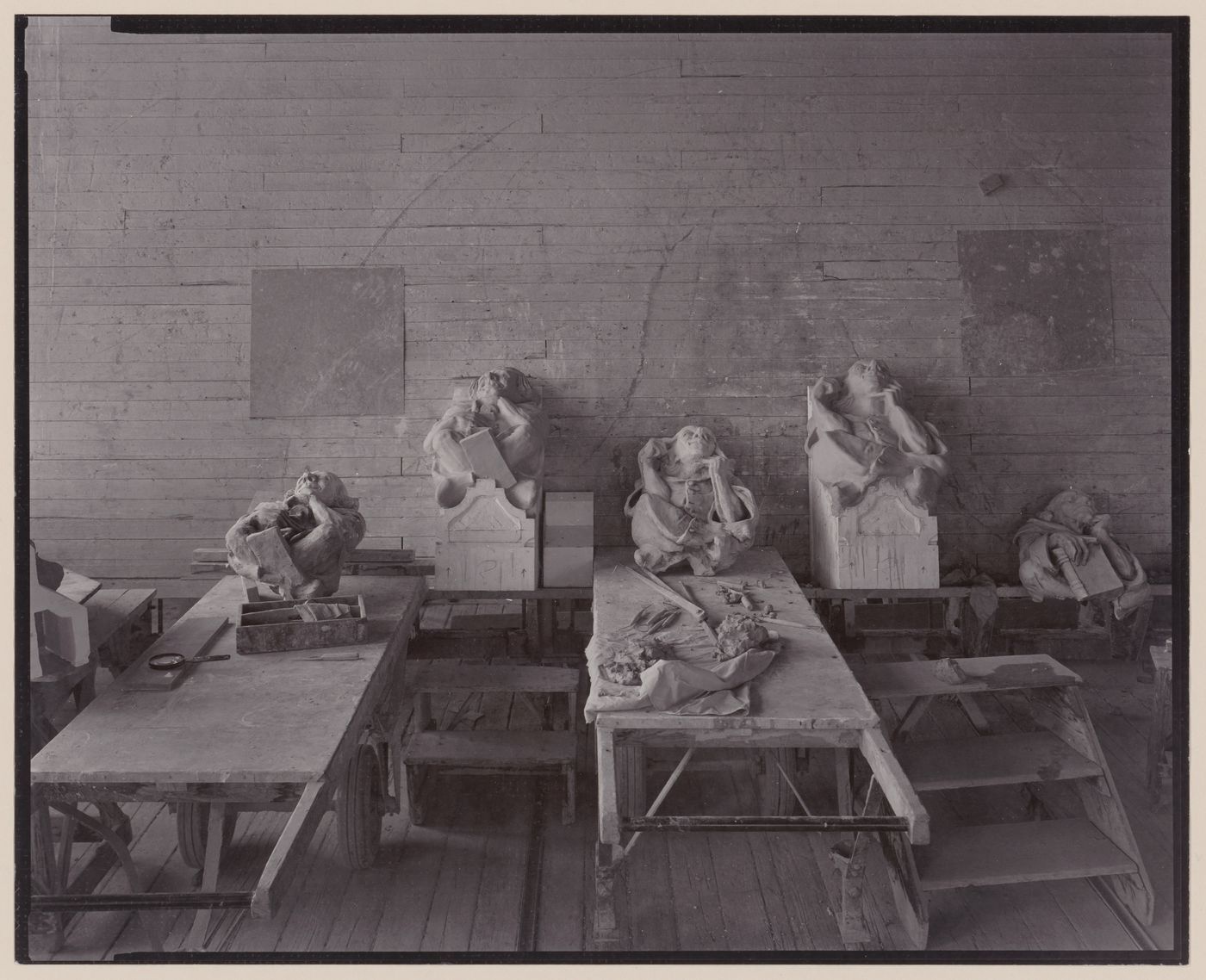 Interior view of terracotta figures on tables in terracotta factory, Lincoln, California