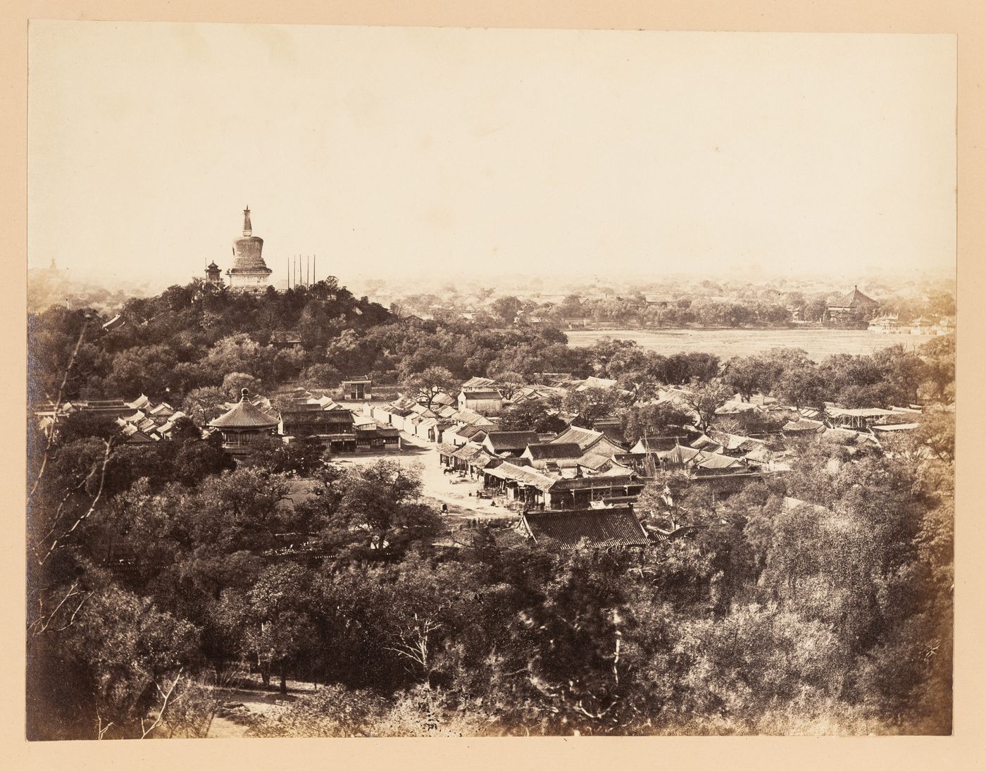 Panoramic view of a section of the Imperial City showing Jade Flowery Island [Qionghua Dao], the White Pagoda [Bai Ta], part of North Lake [Beihai] and other structures in the Western Garden (now Beihai Park), Peking (now Beijing), China