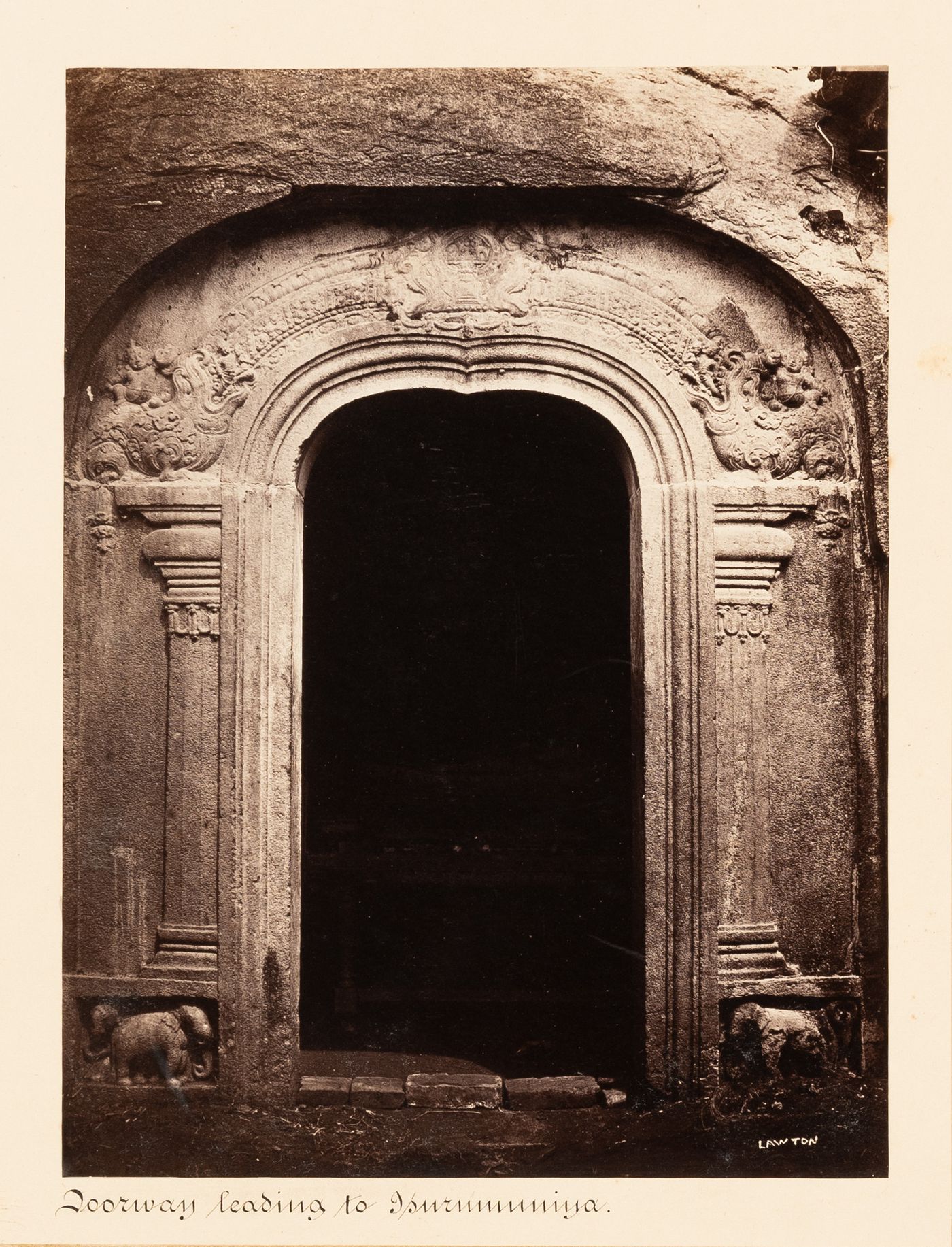 View of the temple doorway from the portico, Isurumuniya Temple, Anuradhapura, Ceylon (now Sri Lanka)