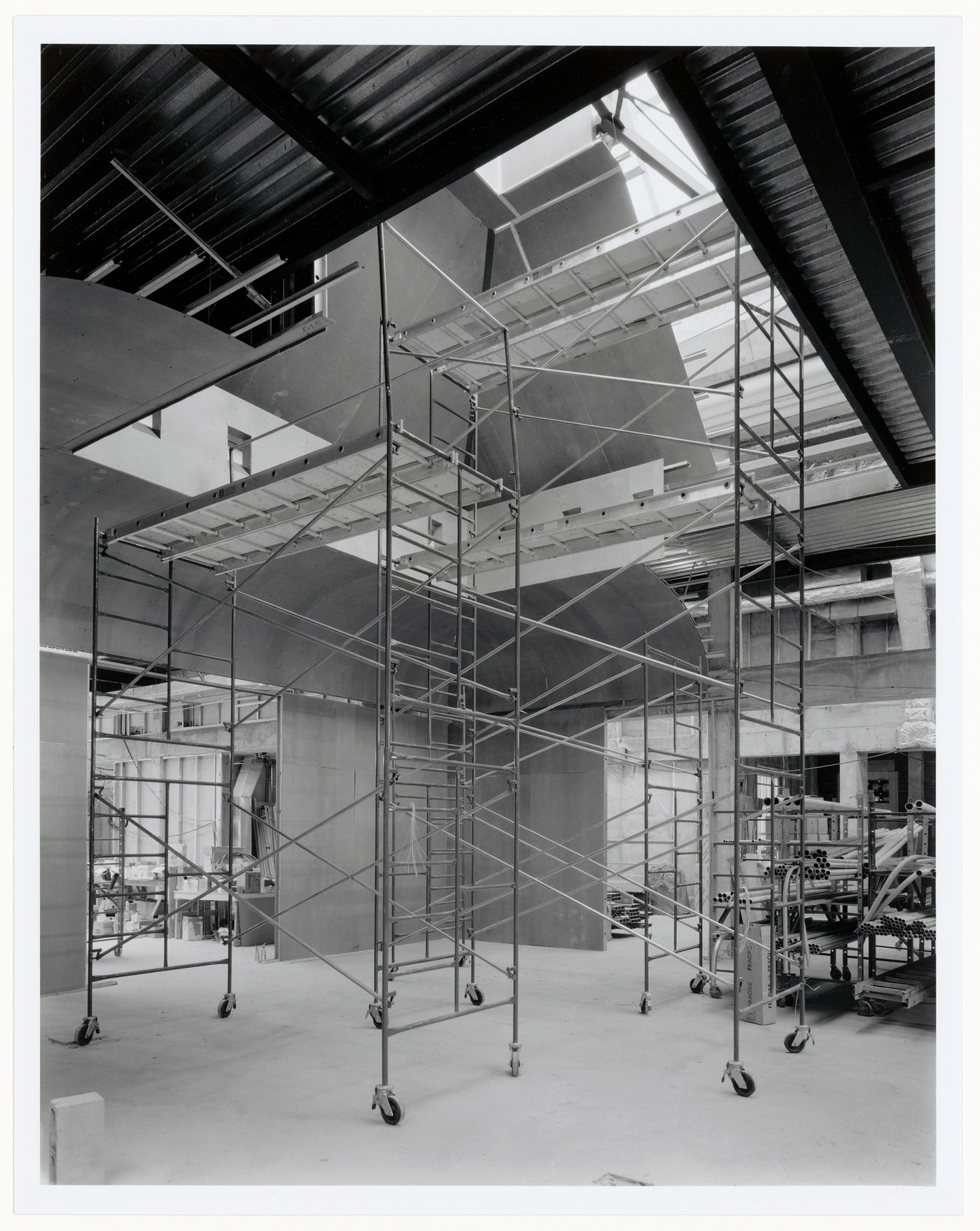 Interior view of an exhibition gallery showing scaffolds, Canadian Centre for Architecture under construction, Montréal, Québec