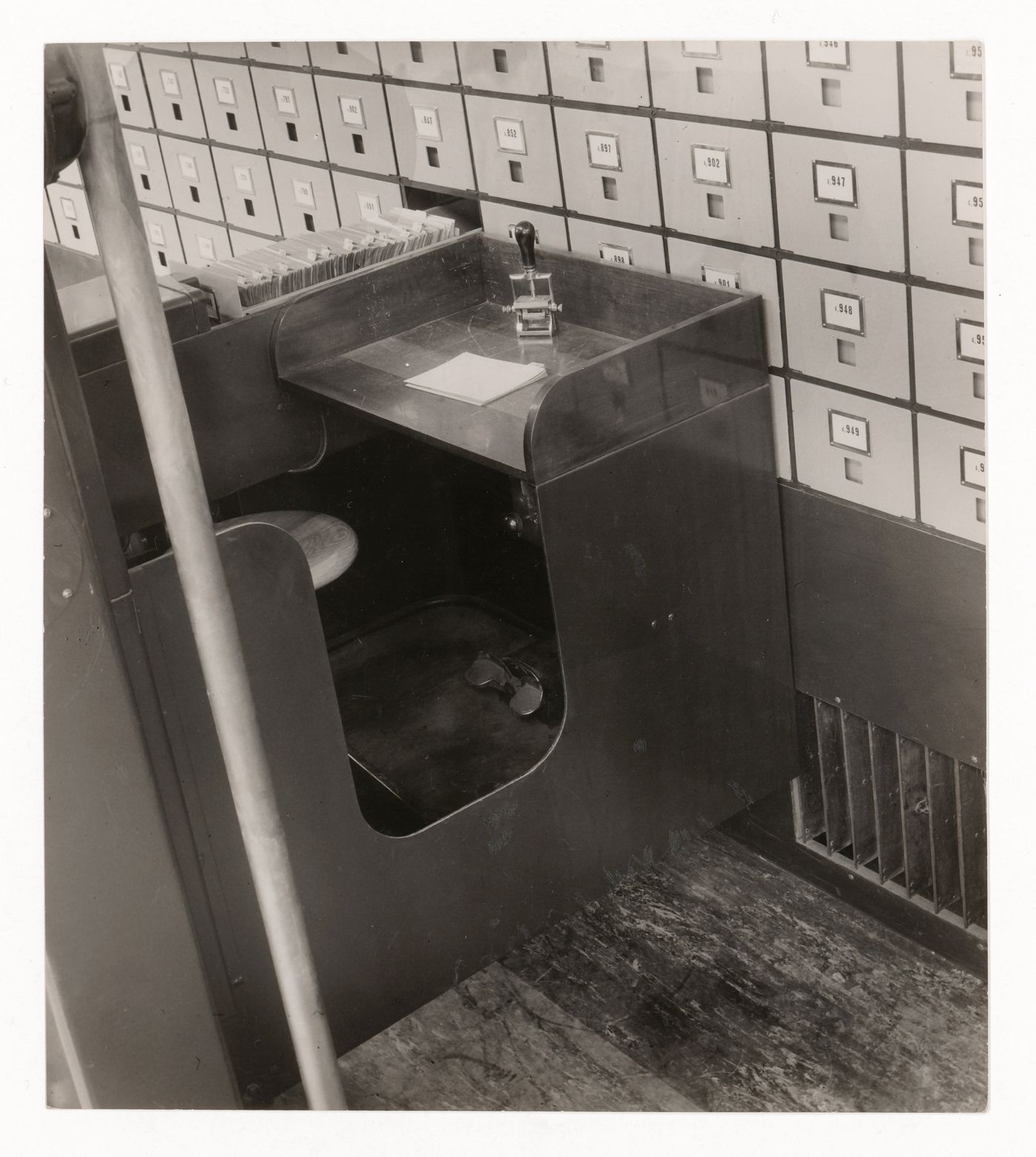 Interior view of the Central Social Insurance Institution showing a close-up view of a mobile work station used to access the card catalog drawers, Prague, Czechoslovakia (now Czech Republic)