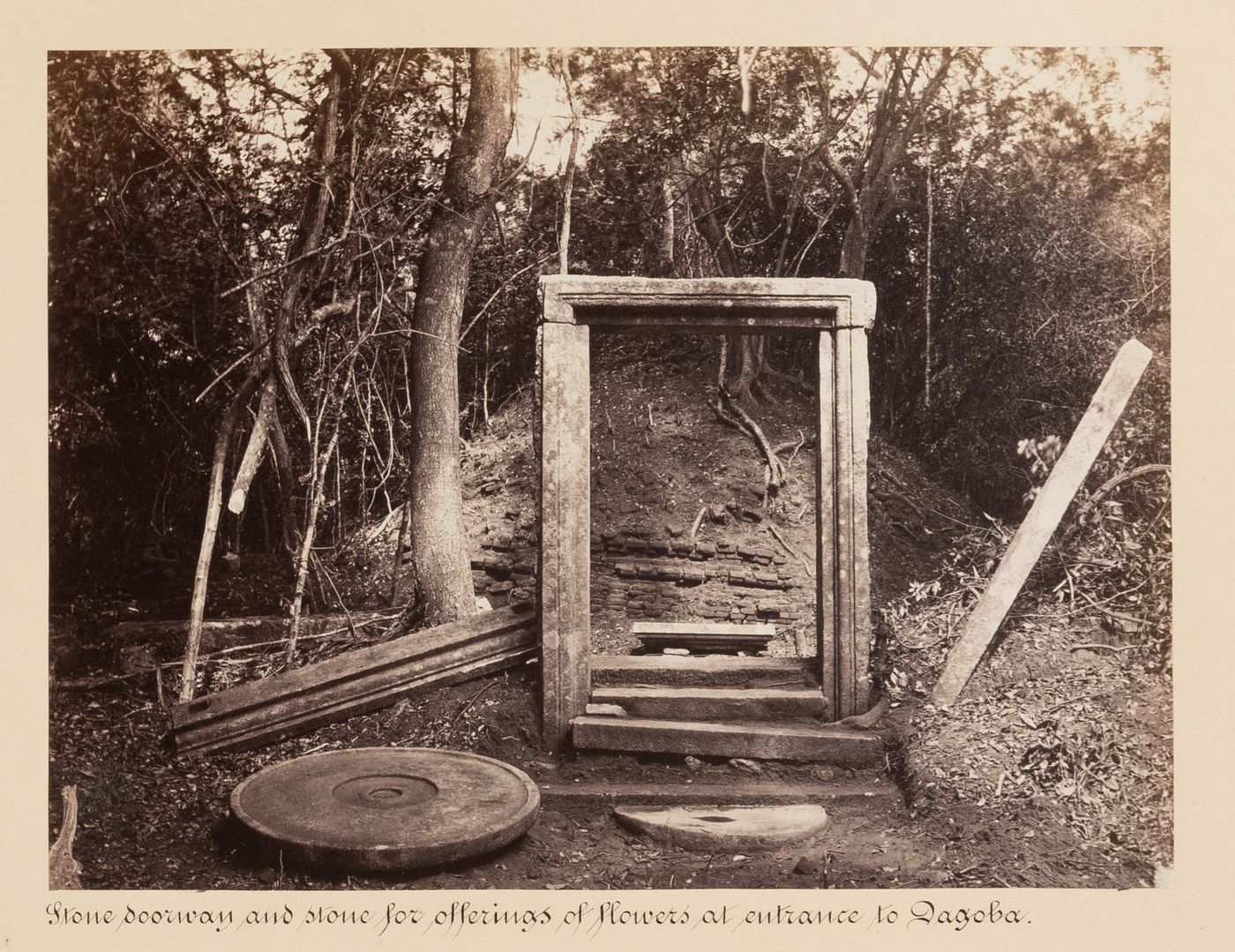 View of a doorway and dagoba with a stone used for offerings in the left foreground, Mihintale, Ceylon (now Sri Lanka)