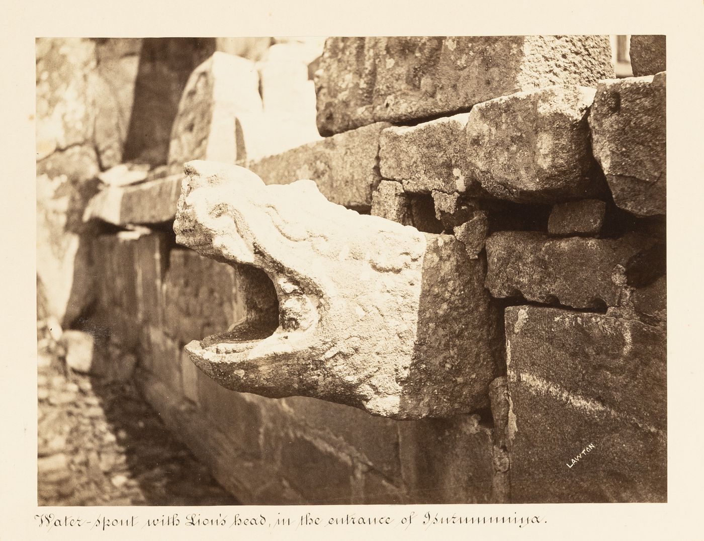 Close-up view of a lion's head waterspout in the portico, Isurumuniya Temple, Anuradhapura, Ceylon (now Sri Lanka)