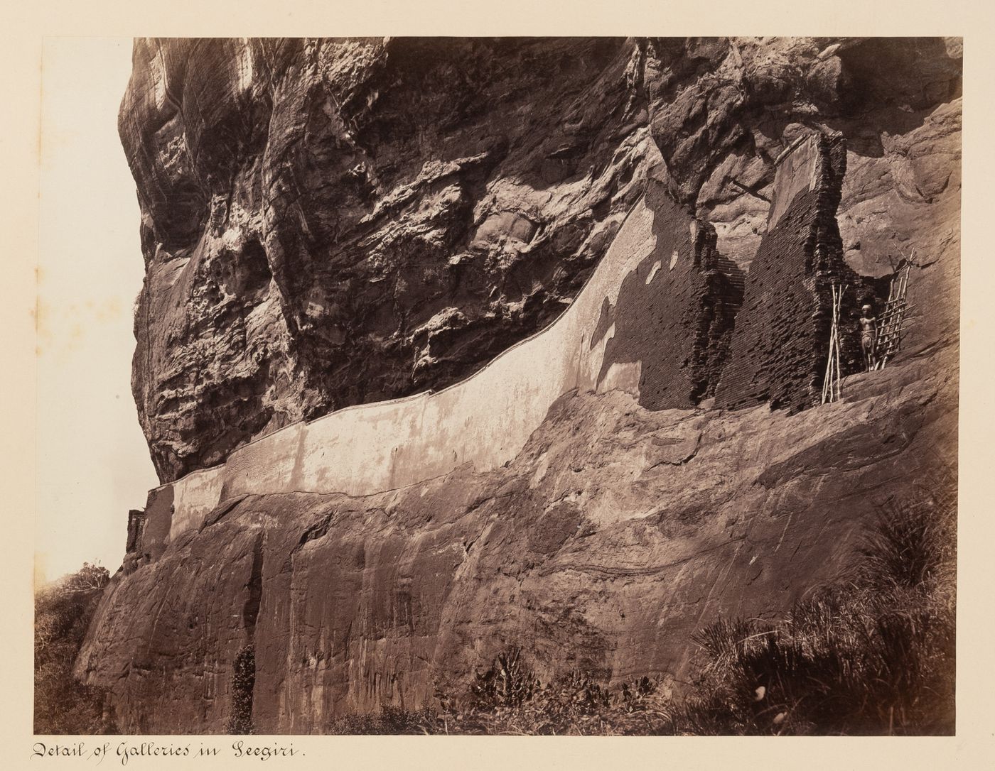 View of the west façade of Sigiriya showing a ladder and passage, Ceylon (now Sri Lanka)