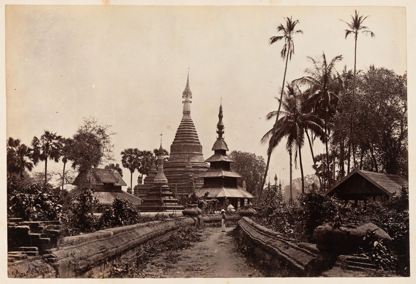 View of a stupa with a smaller stupa, a pagoda and a road in the foreground, Burma (now Myanmar)