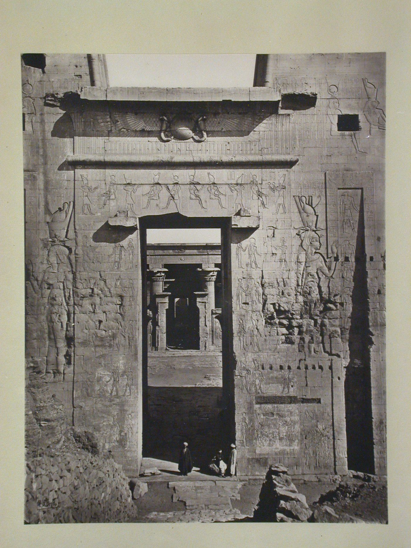 Temple of Horus, enrtrance portal of Pylon, looking through the forecourt, Edfu, Egypt