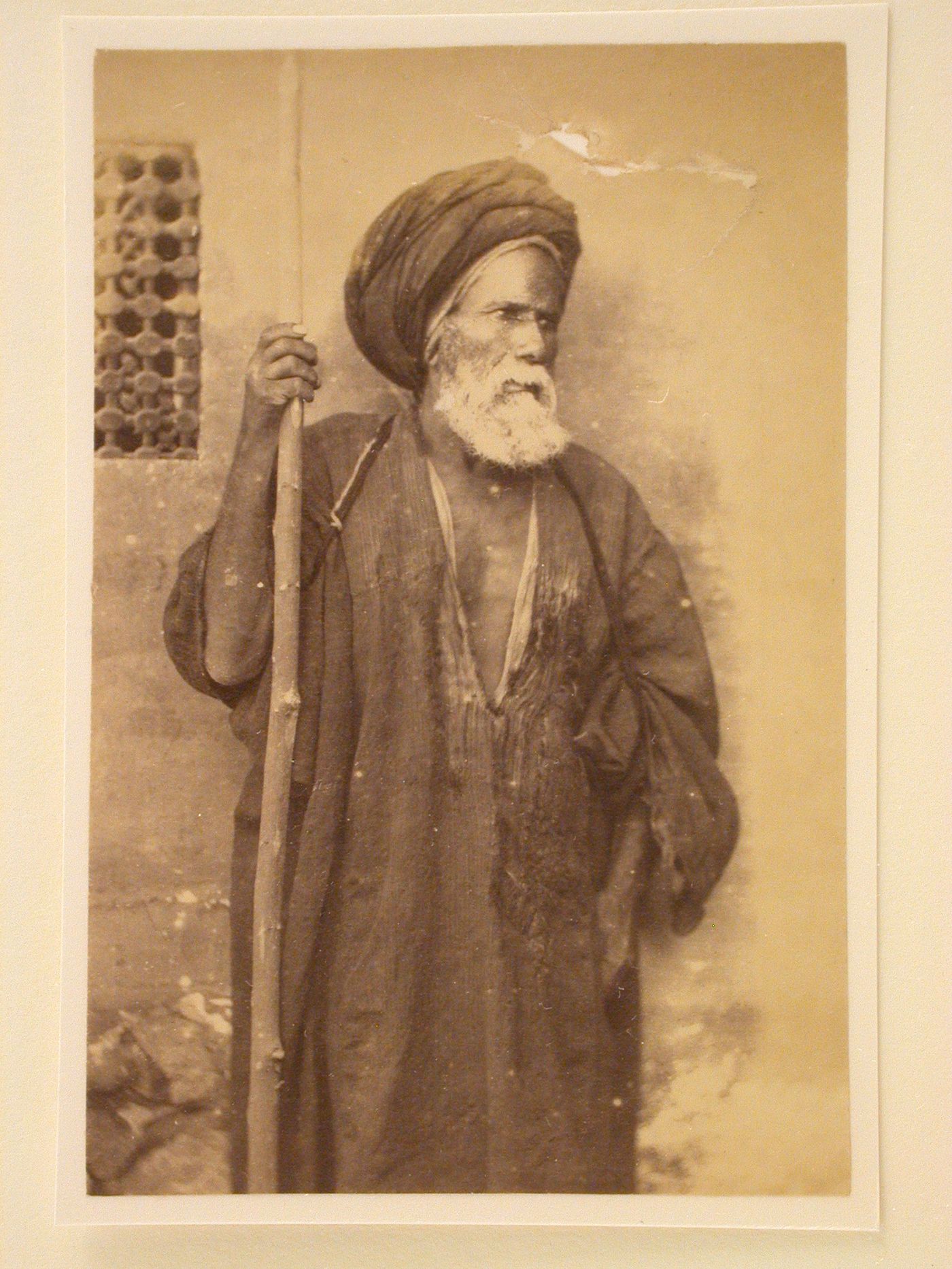 Standing elderly Egyptian man