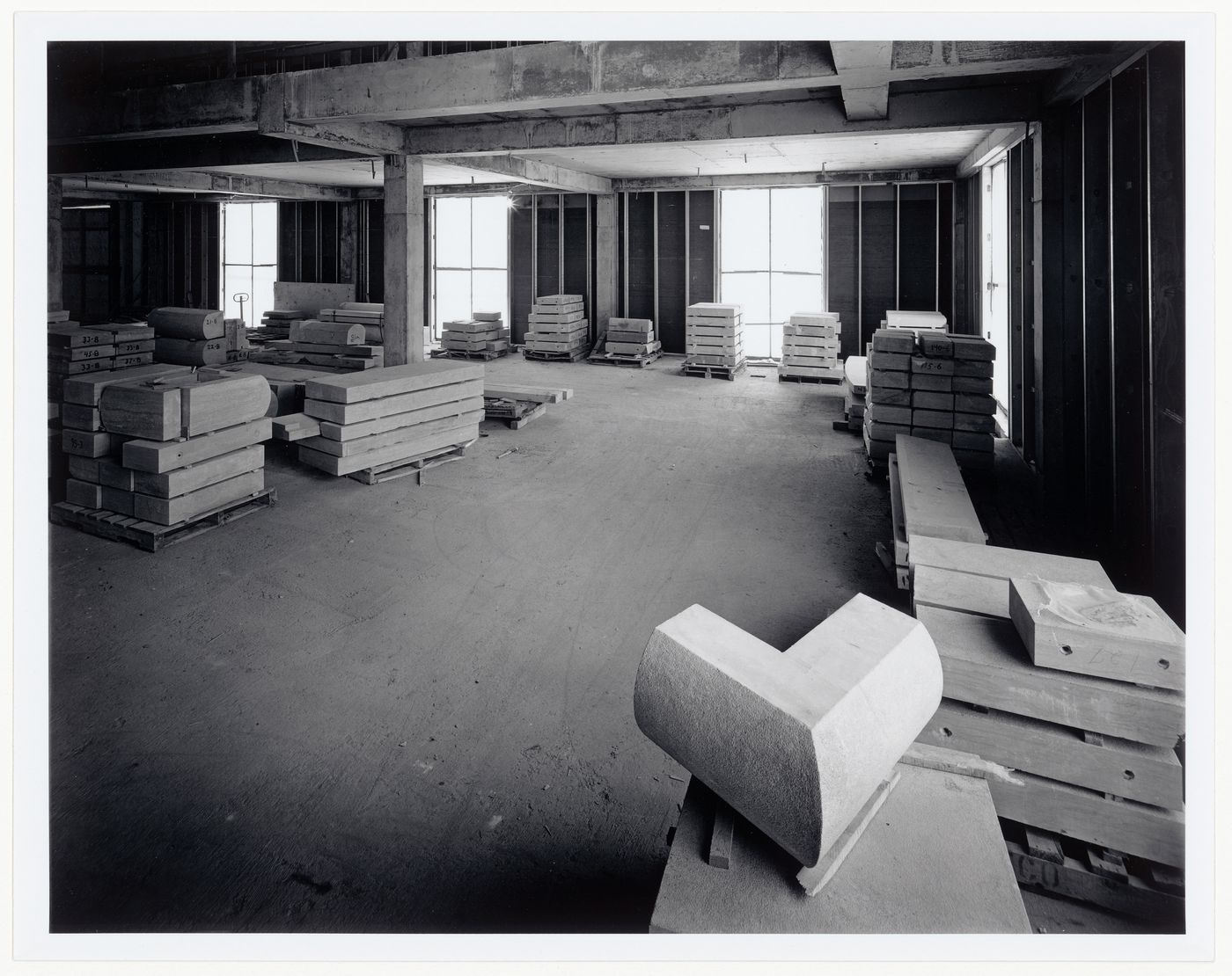 Interior view of the Library Reading Room showing stacked slabs of cut stone, Canadian Centre for Architecture under construction, Montréal, Québec