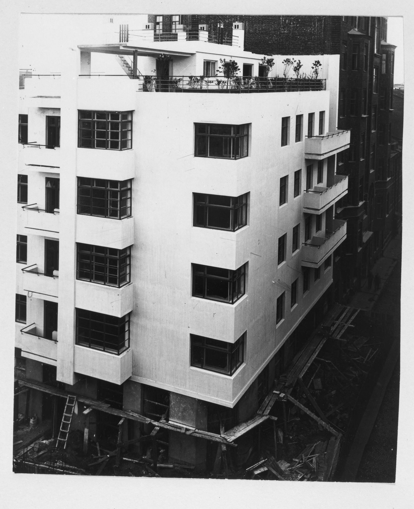 Exterior view of the house-commune for State Insurance (Gosstrakh) employees showing the ground floor under construction, 21 Malaia Bronnaia Street, Moscow