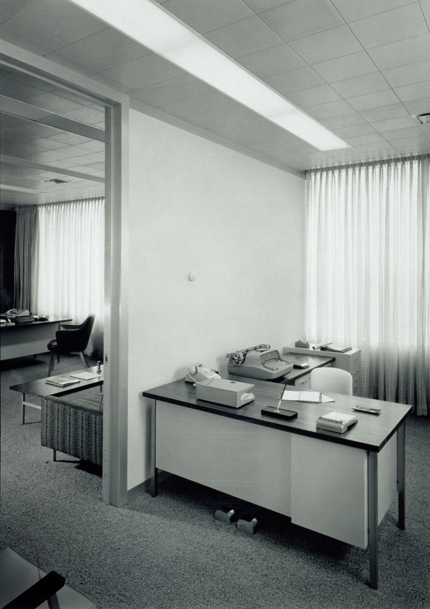 Interior view of an office seen through the doorway and secretary's desk area, Kaiser Center, Oakland, California, United States