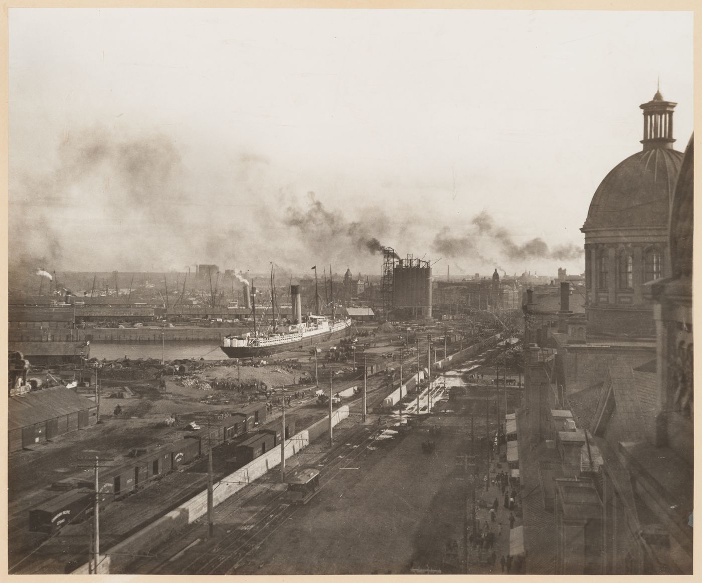 View looking south west from the tower of Notre-Dame-de-Bonsecours at various activities happening on the wharves of the port of Montréal, Québec