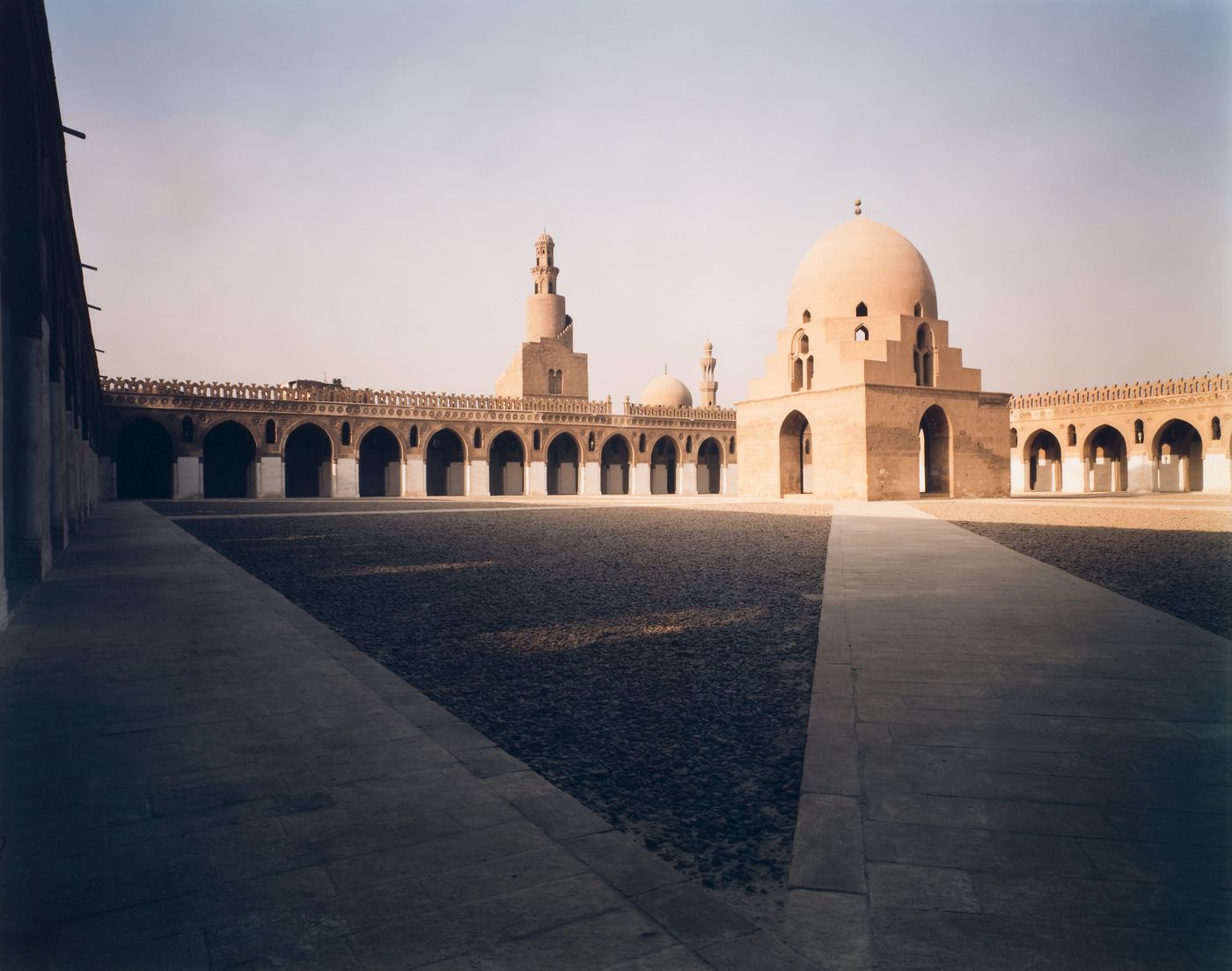 Mosque of Ibn Tulan, view of inner courtyard with two angled pathways converging in foreground, Cairo, Egypt