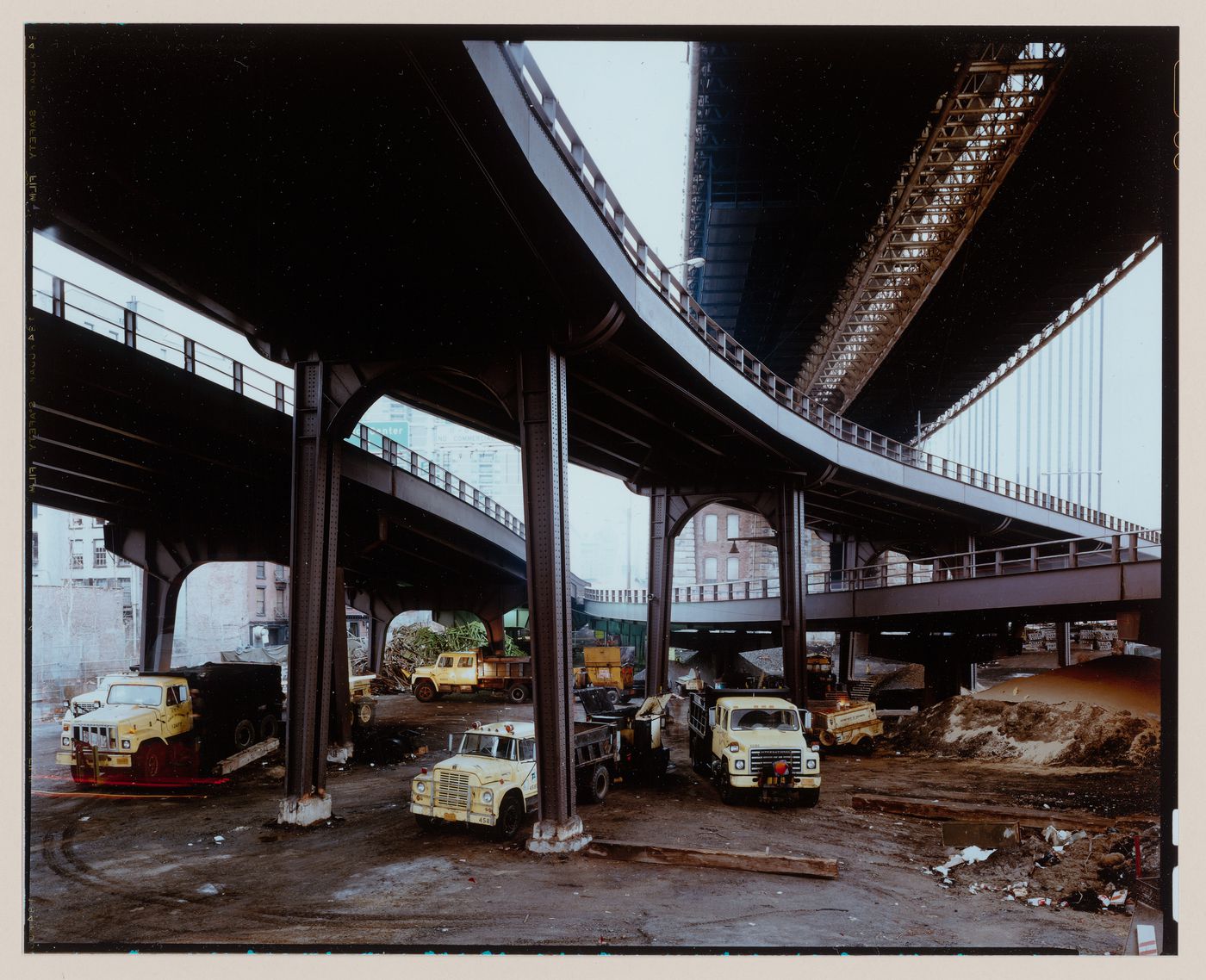 Dept. of Highways' Asphalt Trucks under the Brooklyn Bridge, Manhattan side.
