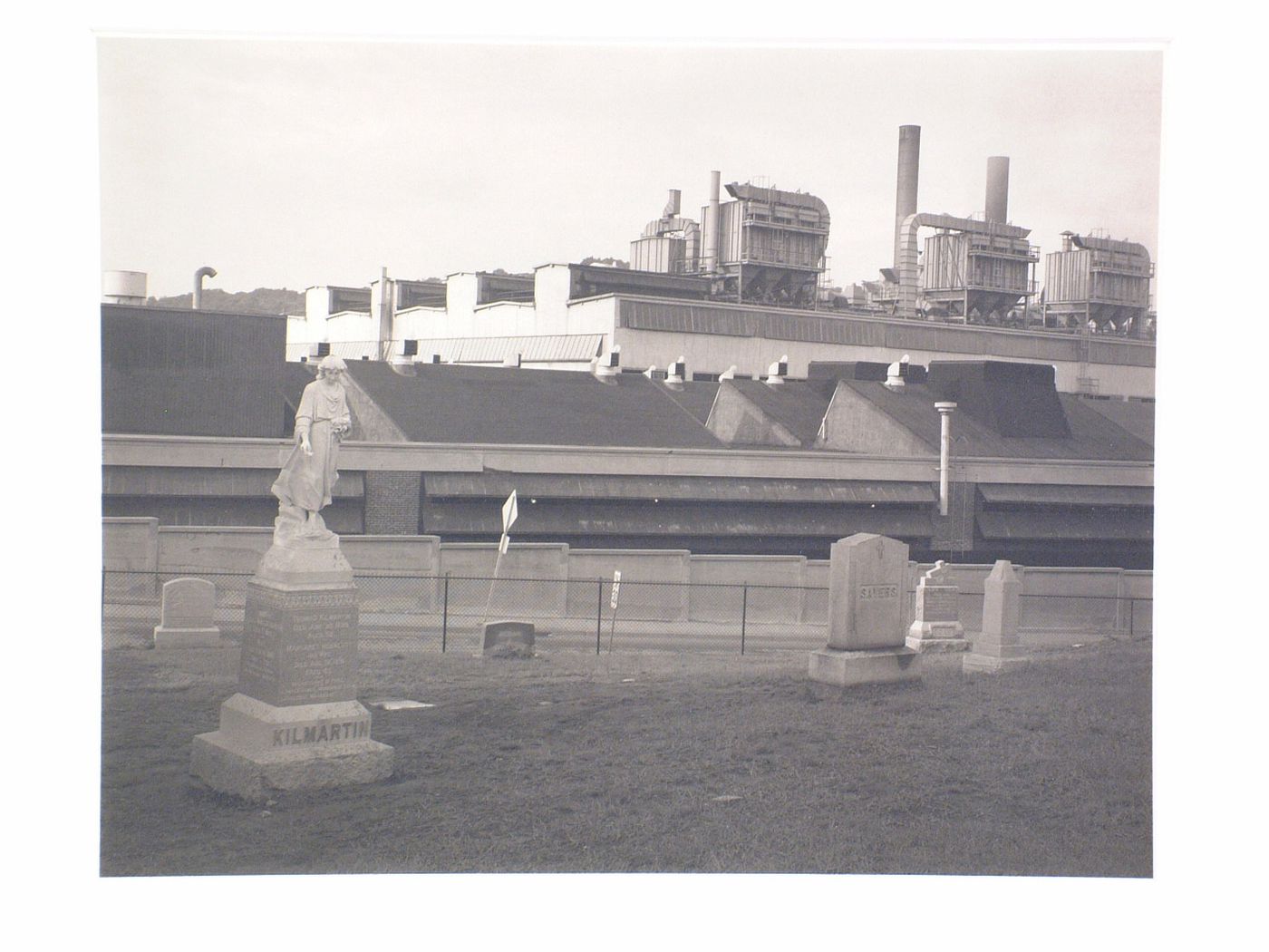 Factory with graveyard juxtaposed in foreground, Waterbury, Connecticut