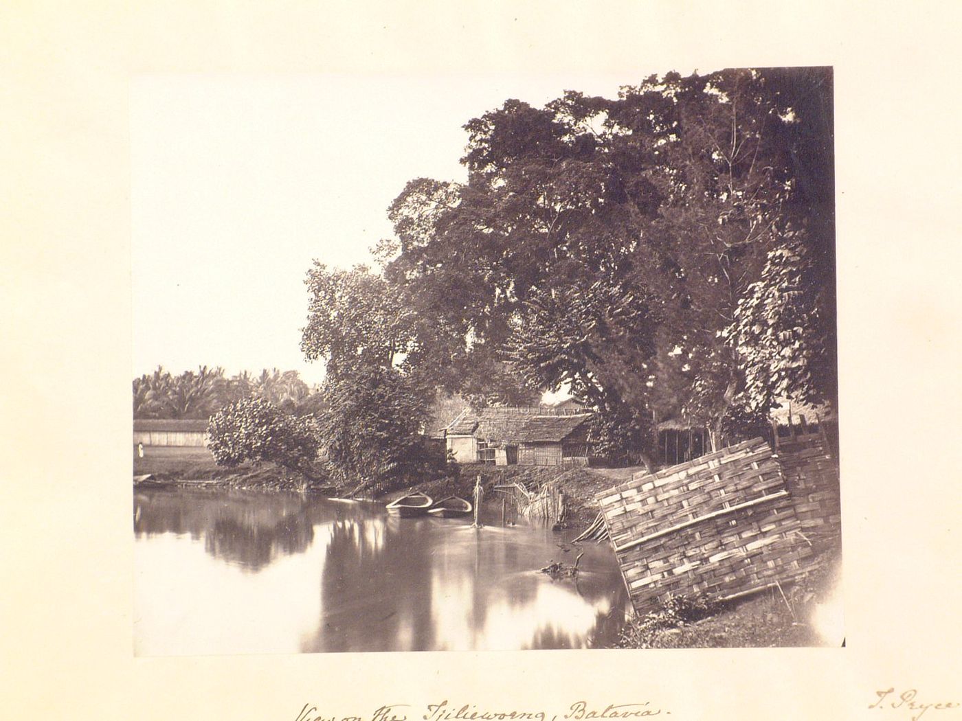 View of houses and the Ciliwung River, in or near Batavia (now Jakarta), Dutch East Indies (now Indonesia)