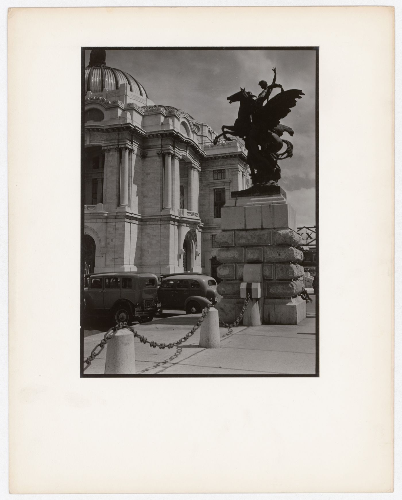Partial view of Palacio de Bellas Artes with a statue in the foreground, Mexico City, Mexico