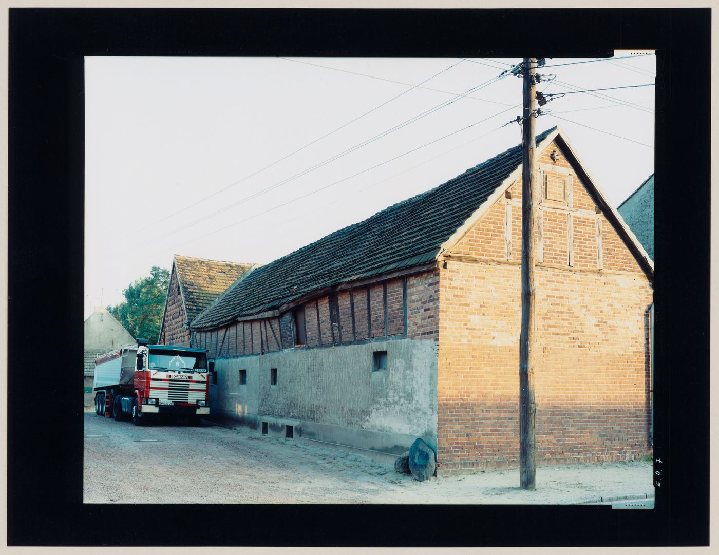 View of a brick building and a truck, Germany (from the series "In between cities")