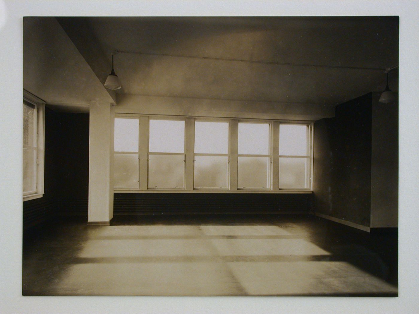 Interior view of inspections agency for electrical works, showing an empty room with sun coming in windows, Frankfurt am Main, Germany