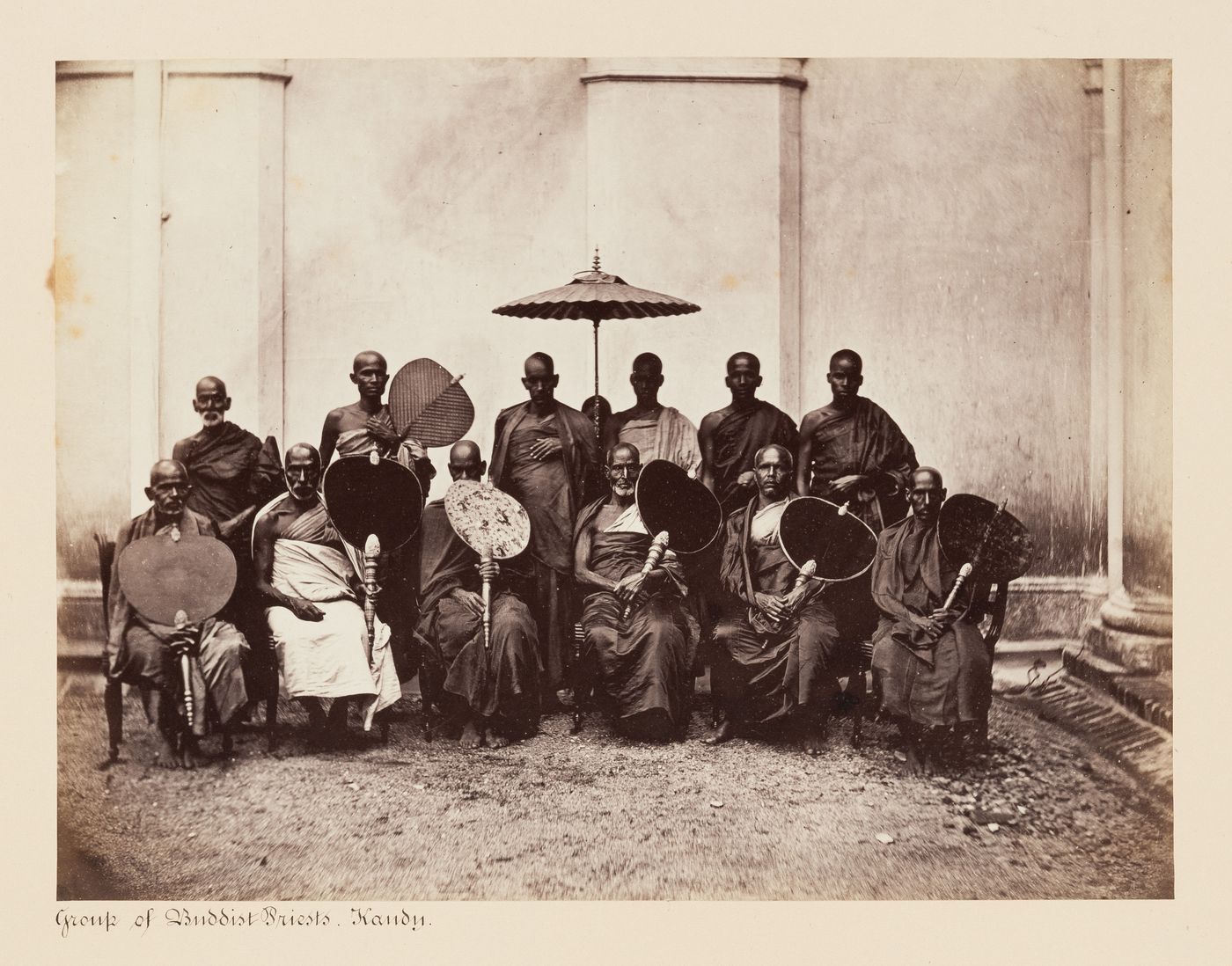 Group portrait of Buddhist priests, Kandy, Ceylon (now Sri Lanka)