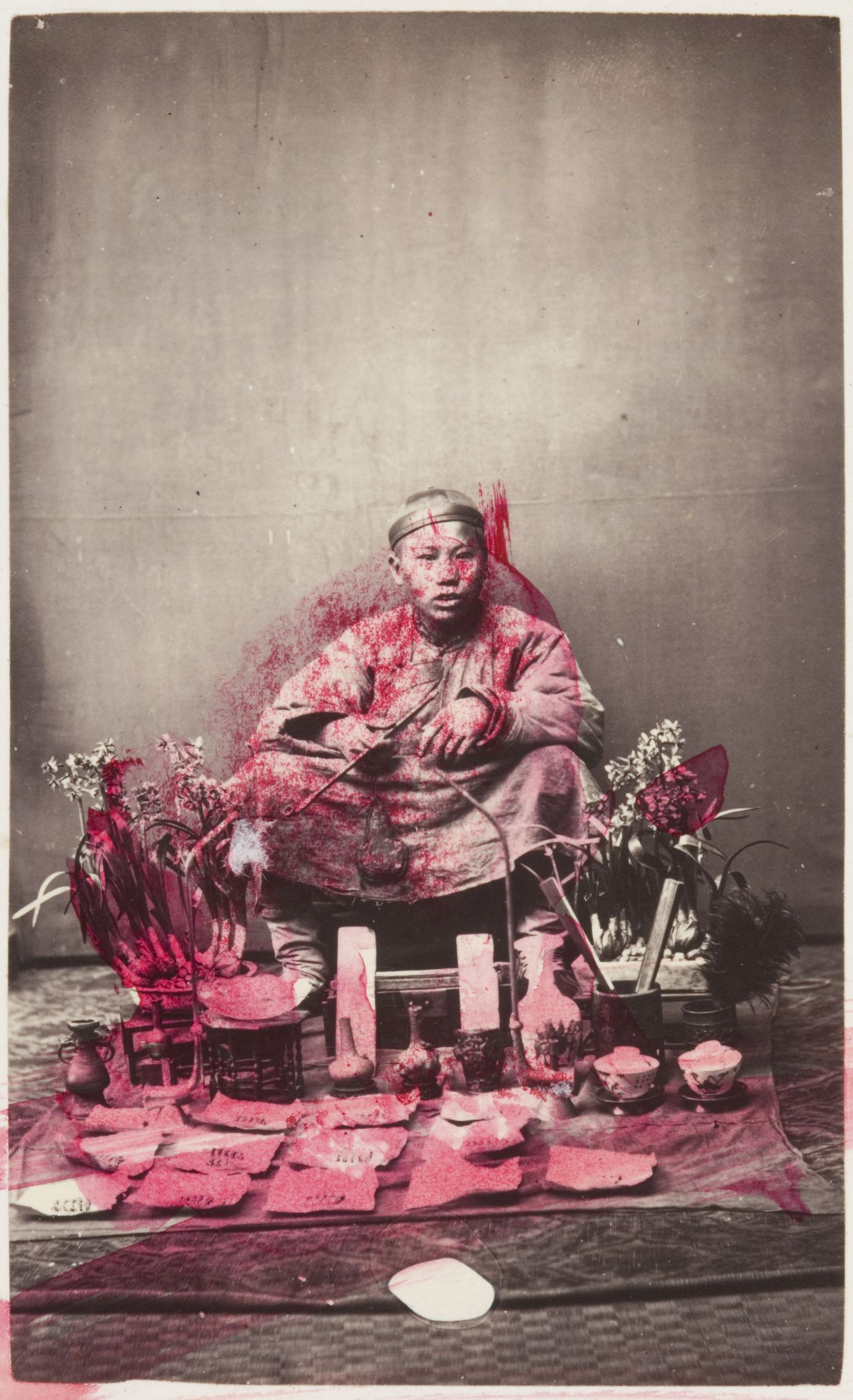 Portrait of a Chinese peddler seated with his wares