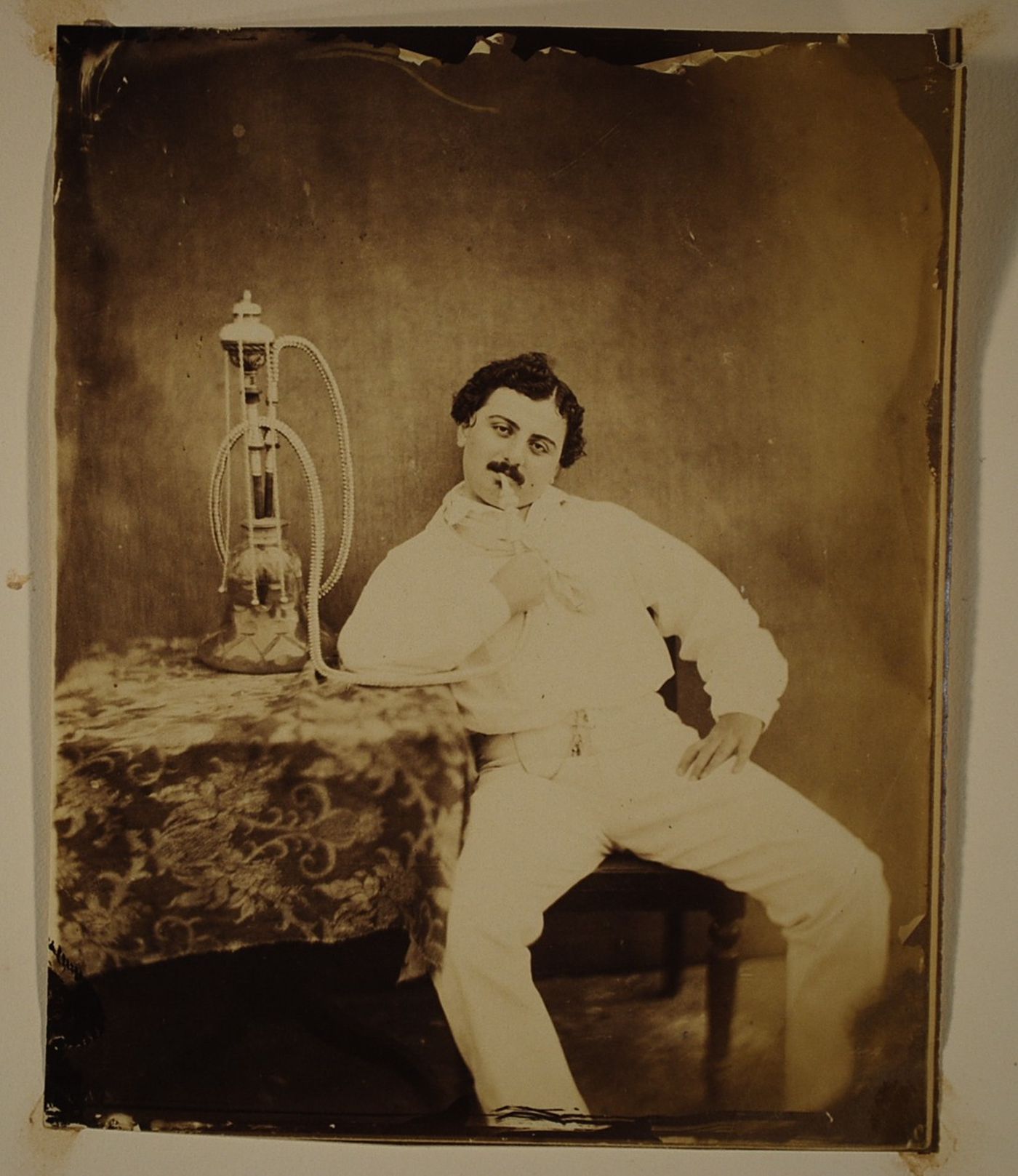 Portrait of a man smoking a hookah, India