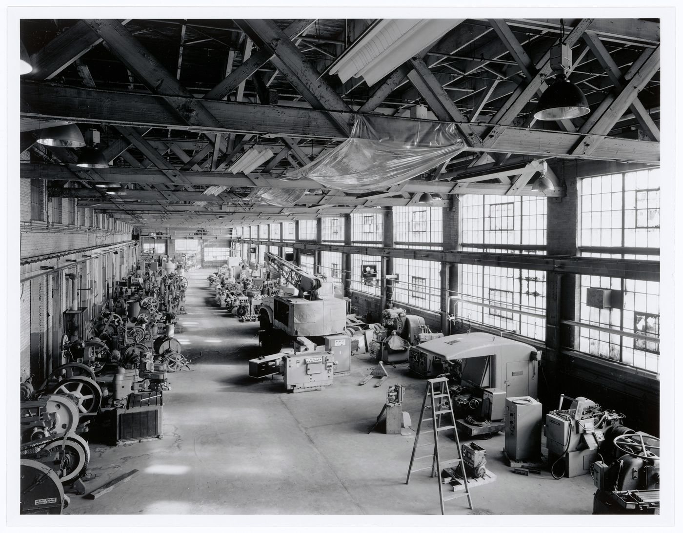 Interior view of the southeast quadrant of the Canadian Switch & Spring Company Building showing machinery, Montréal, Québec