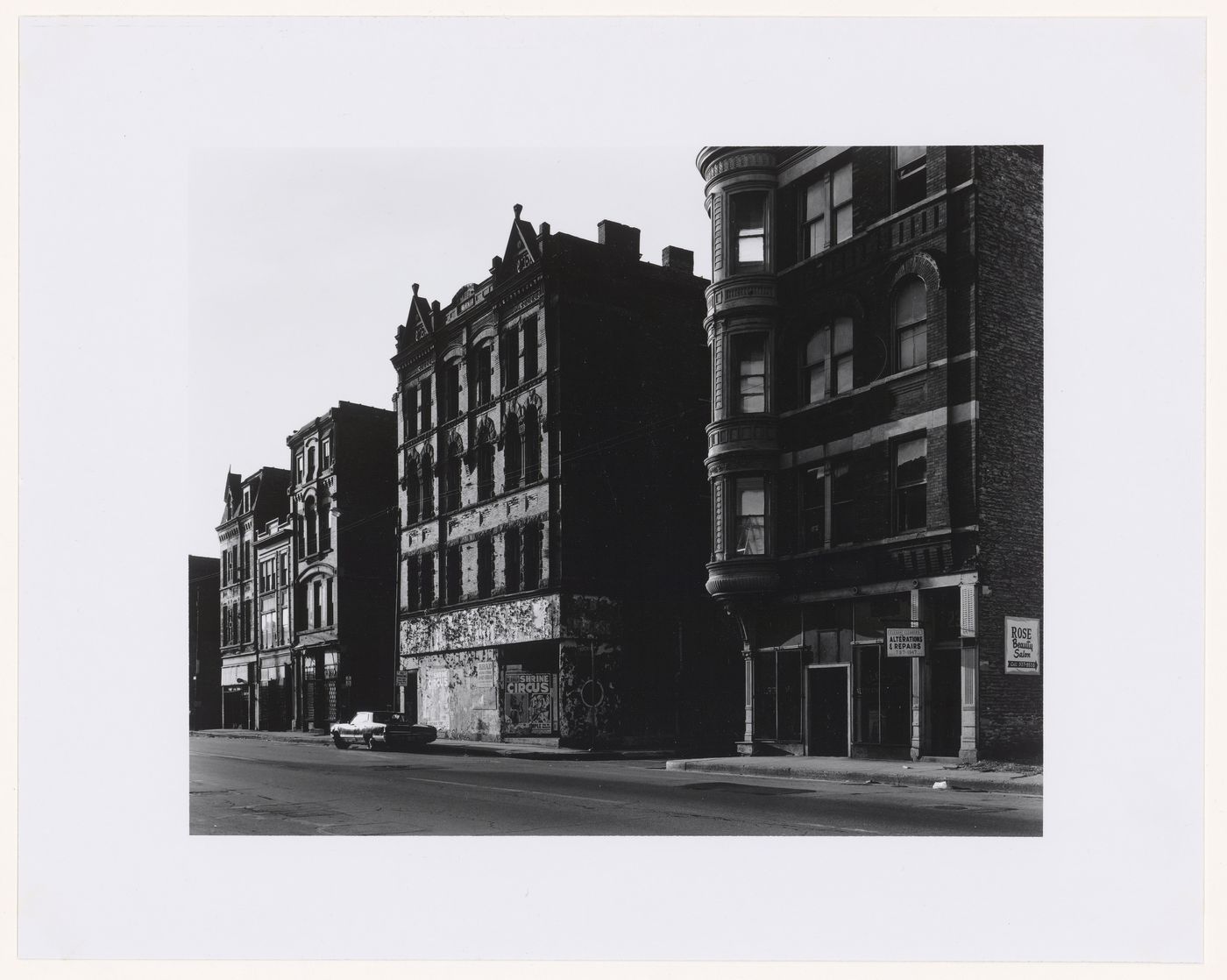 View of buildings along North Avenue showing an abandoned and deteriorating building in the centre, corner of North Avenue and Burling Street, Chicago, Illinois, United States