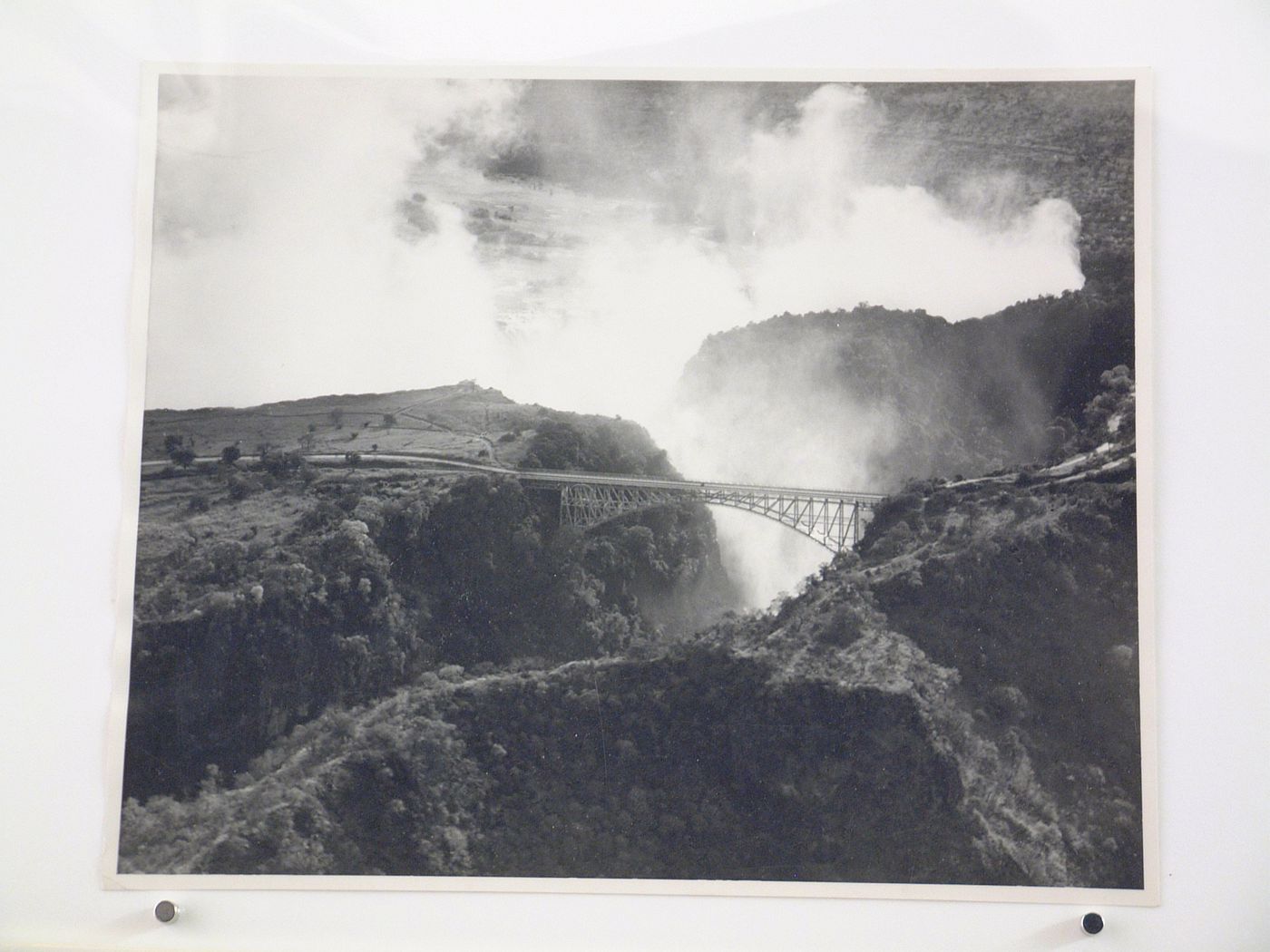 View of Victoria Falls Bridge and waterfall from above, Zambezi River, crossing the border between Victoria Falls, Zimbabwe and Livingstone, Zambia