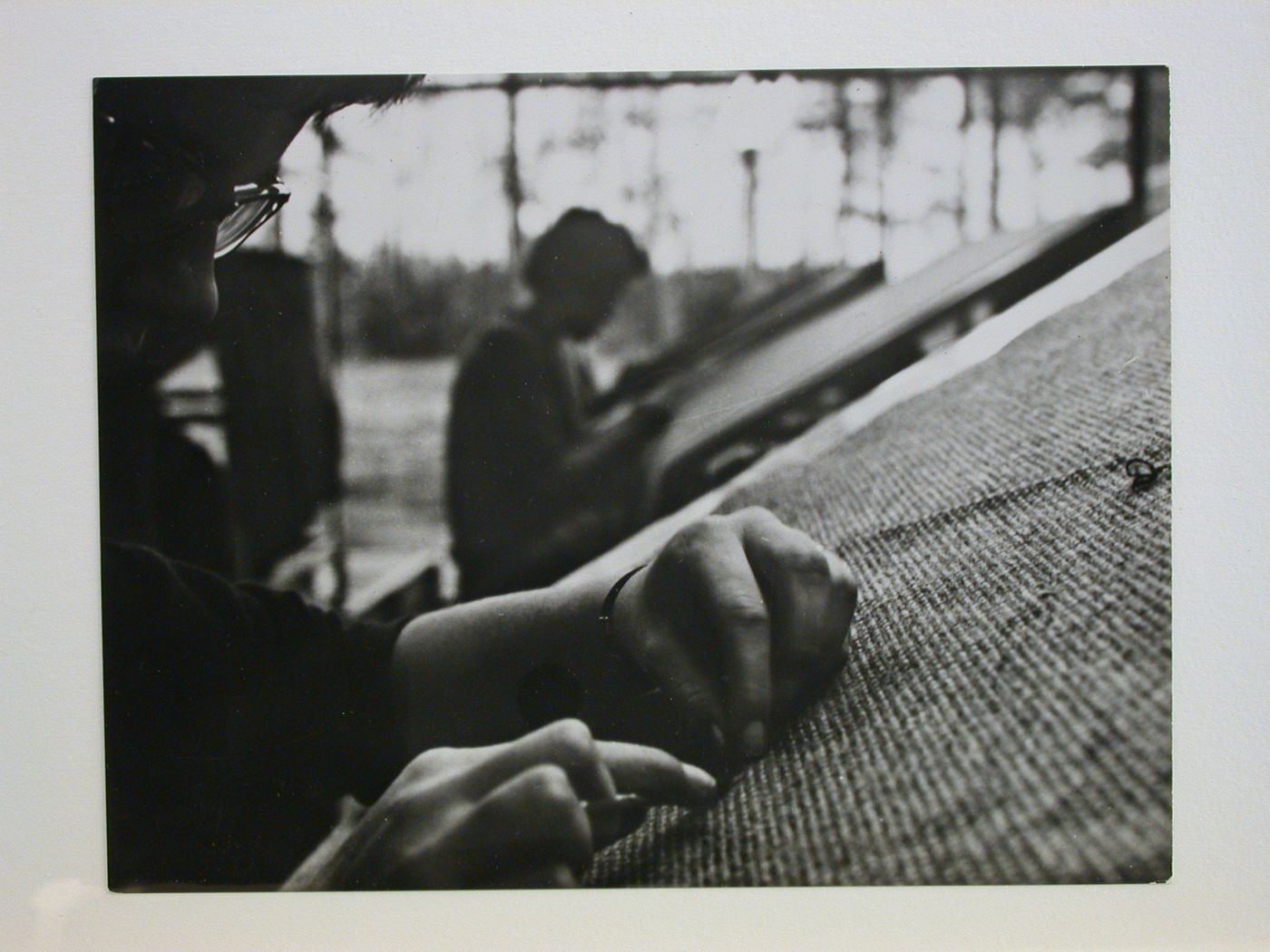 Detail of the hands of a weaver at work, De Ploeg Textile Works, Bergeyk, Netherlands
