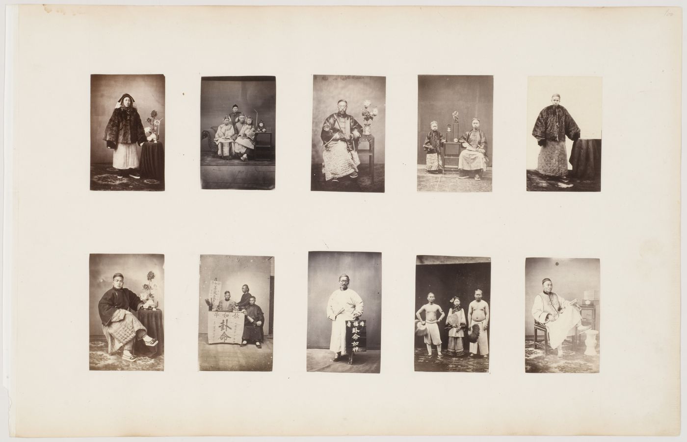 Portrait of a Chinese family beside a stand