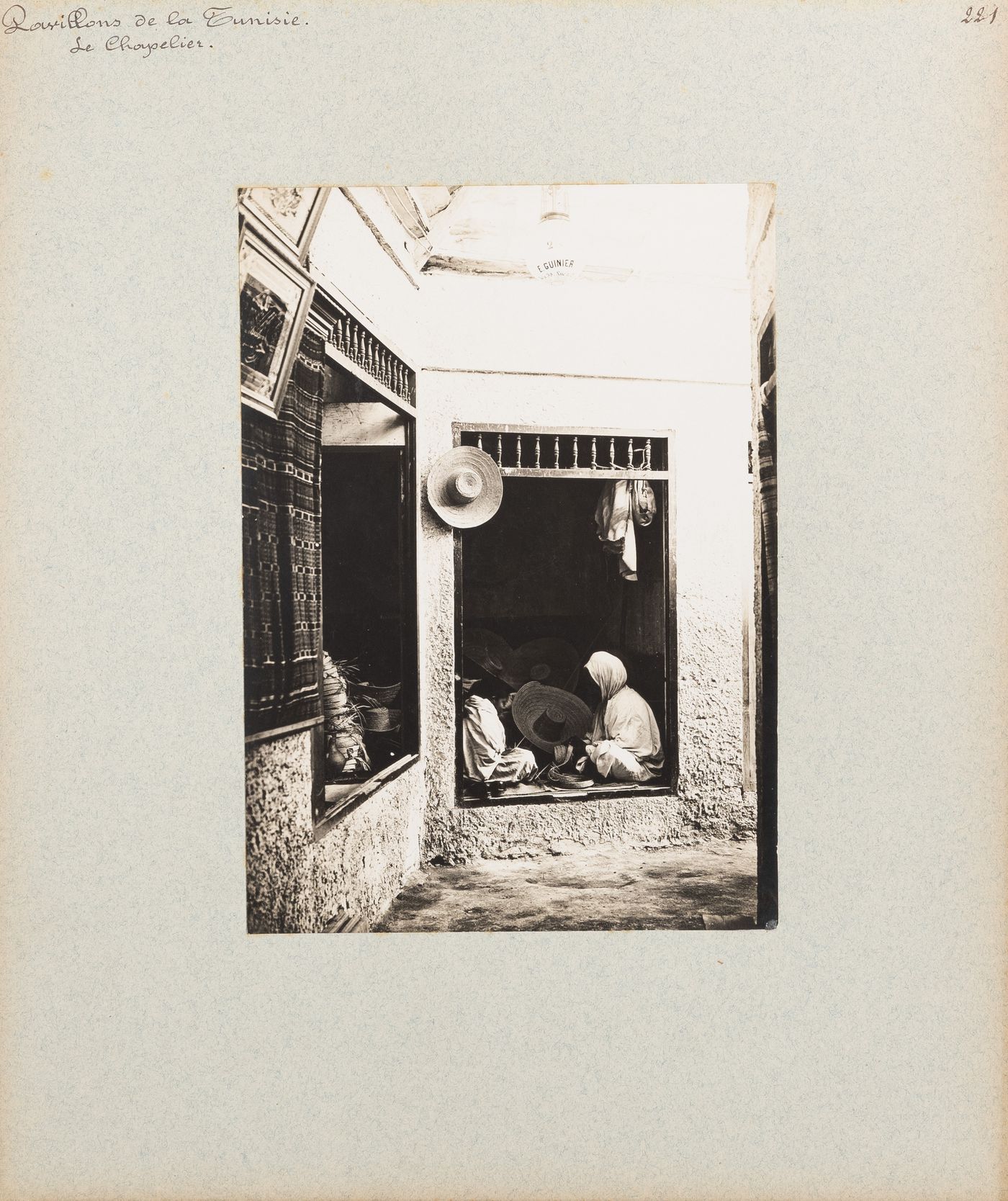 View of two women working in hat maker's shop, Tunisian section, Exposition universelle, 1900, Paris, France