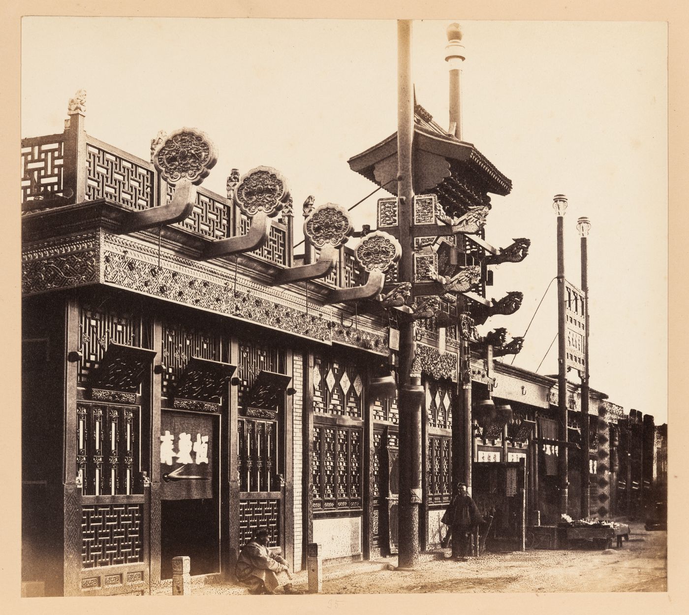 View of shops in a street in the Outer City (also known as the Chinese City), Peking (now Beijing), China